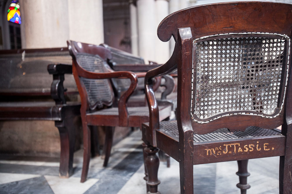 During the twentieth century, a few elite women who gave large donations have their names written on the backs of chairs at the Magen David Synagogue, pictured on these chairs in August 2014. The rest had small labels that were tied to the chair.