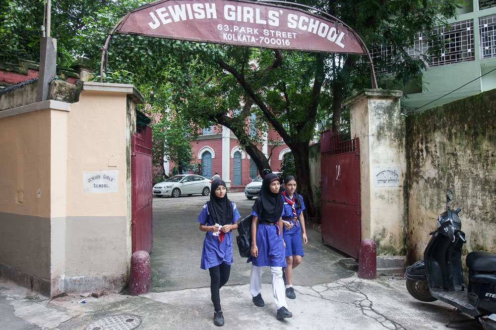 Students of the Jewish Girls' School in August 2014. More than 80% of the students come from orthodox Muslim families. None of the students at the school are Jewish. They wear school uniforms while in class but once outside, many change into traditional salwar kameez and burkhas.