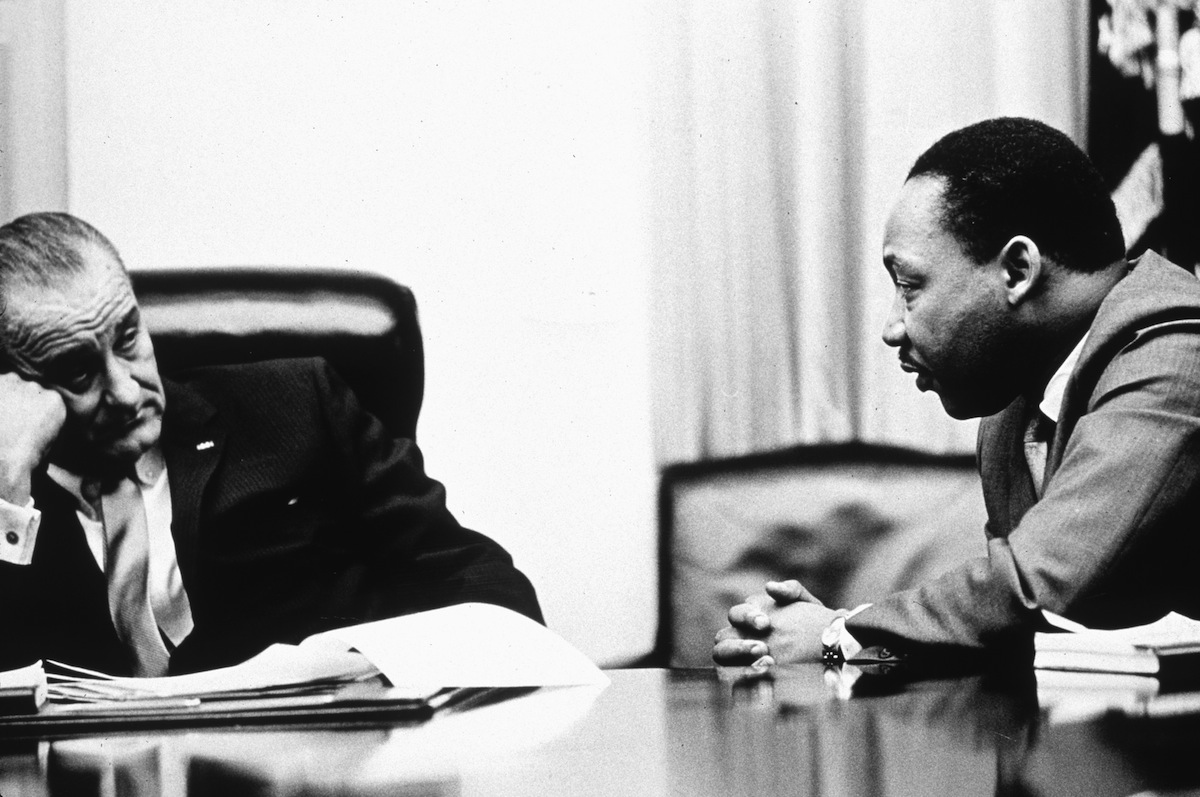 President Lyndon B Johnson (1908 - 1973) discusses the Voting Rights Act with civil rights campaigner Martin Luther King Jr. (1929 - 1968) in 1965 (Hulton Archive—Getty Images)