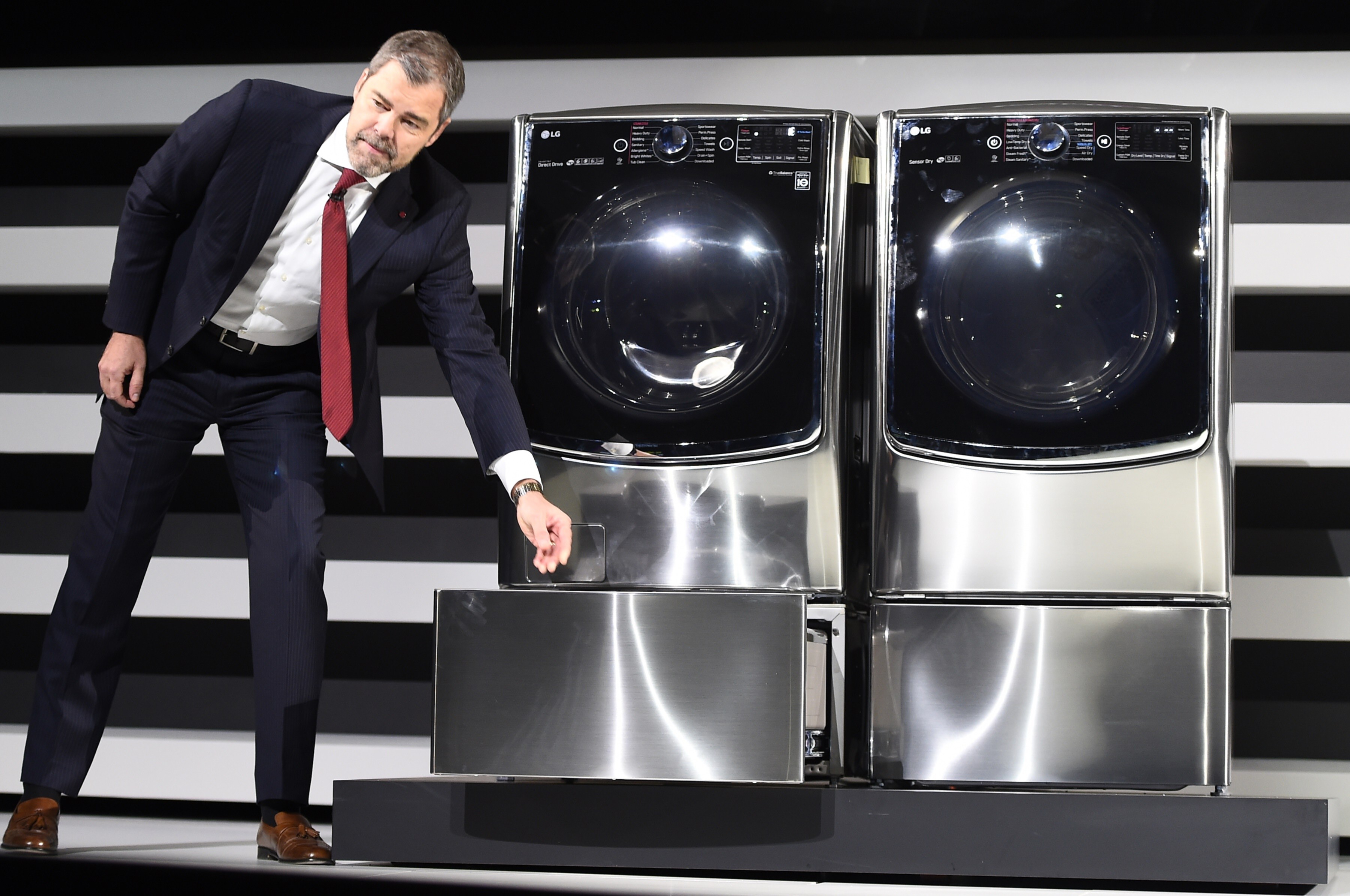 LG Electronic's David VanderWall introduces the LG front loading washing machine with the new Twin Load System allowing the consumer to do two separate washing loads at the same time, at the LG press conference at 2015 Consumer Electronics Show in Las Vegas, Nevada on Jan. 5, 2015. (Robyn Beck&mdash;AFP/Getty Images)
