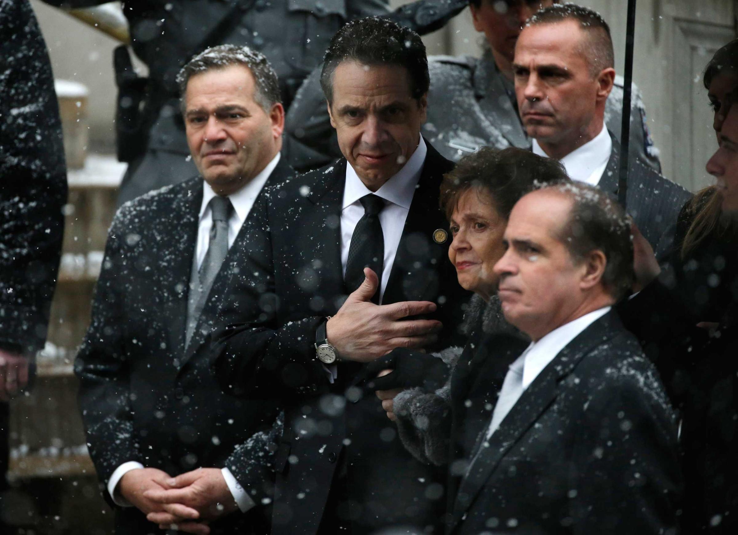 New York Governor Andrew Cuomo watches the casket of his late father, former New York Governor Mario Cuomo, being carried into St. Ignatius Loyola Church for funeral service in New York