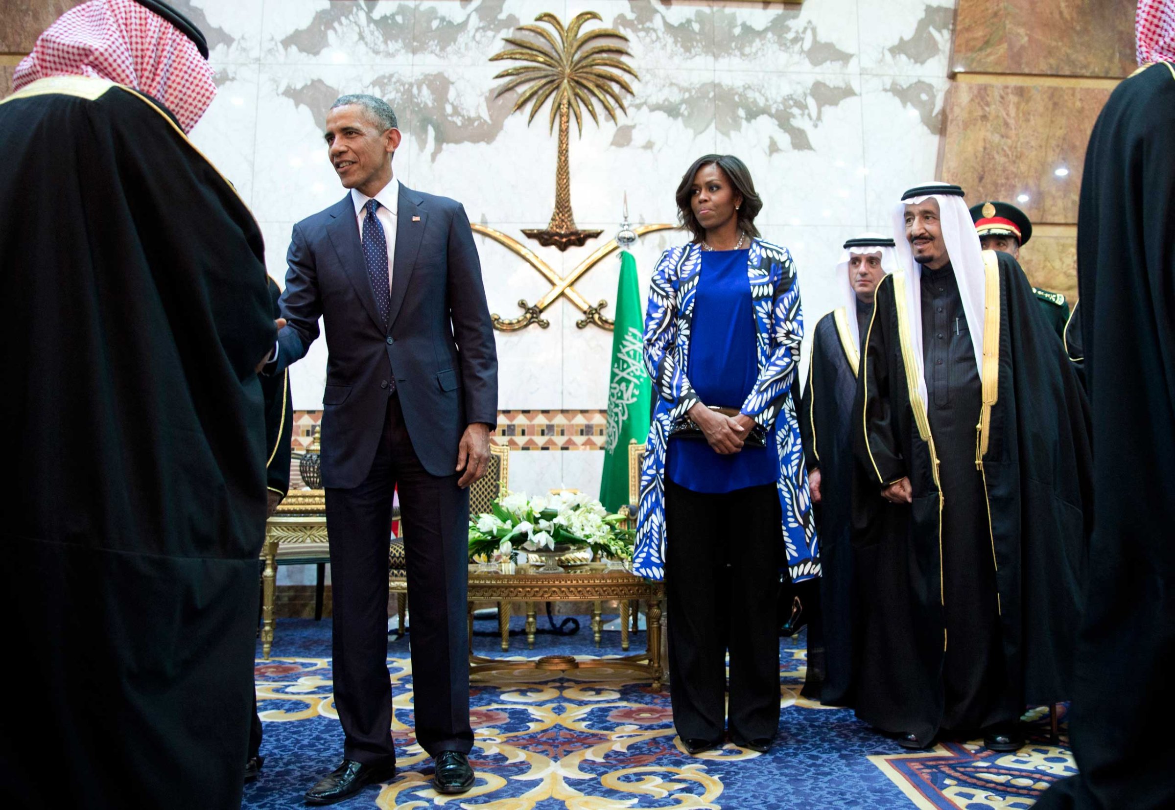 President Barack Obama and First Lady Michelle Obama participate in a delegation receiving line with new Saudi Arabian King, Salman bin Abdul Aziz, right, in Riyadh, Jan. 27, 2015.