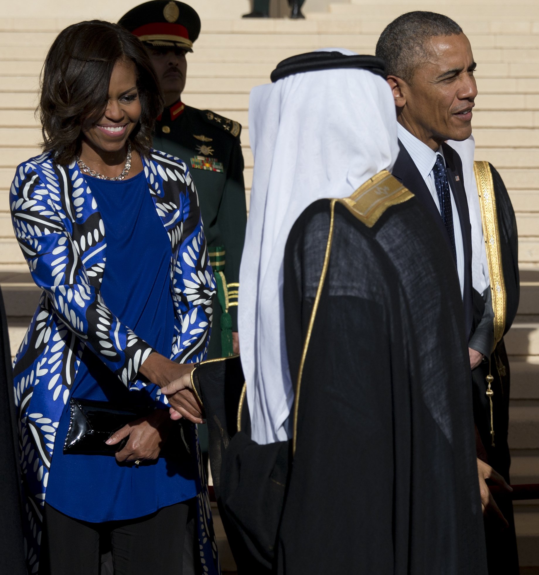 President Barack Obama and first lady Michelle Obama stand with new Saudi King Salman bin Abdul Aziz for a receiving line as they arrive at King Khalid International Airport, in Riyadh, Saudi Arabia on Jan. 27, 2015.