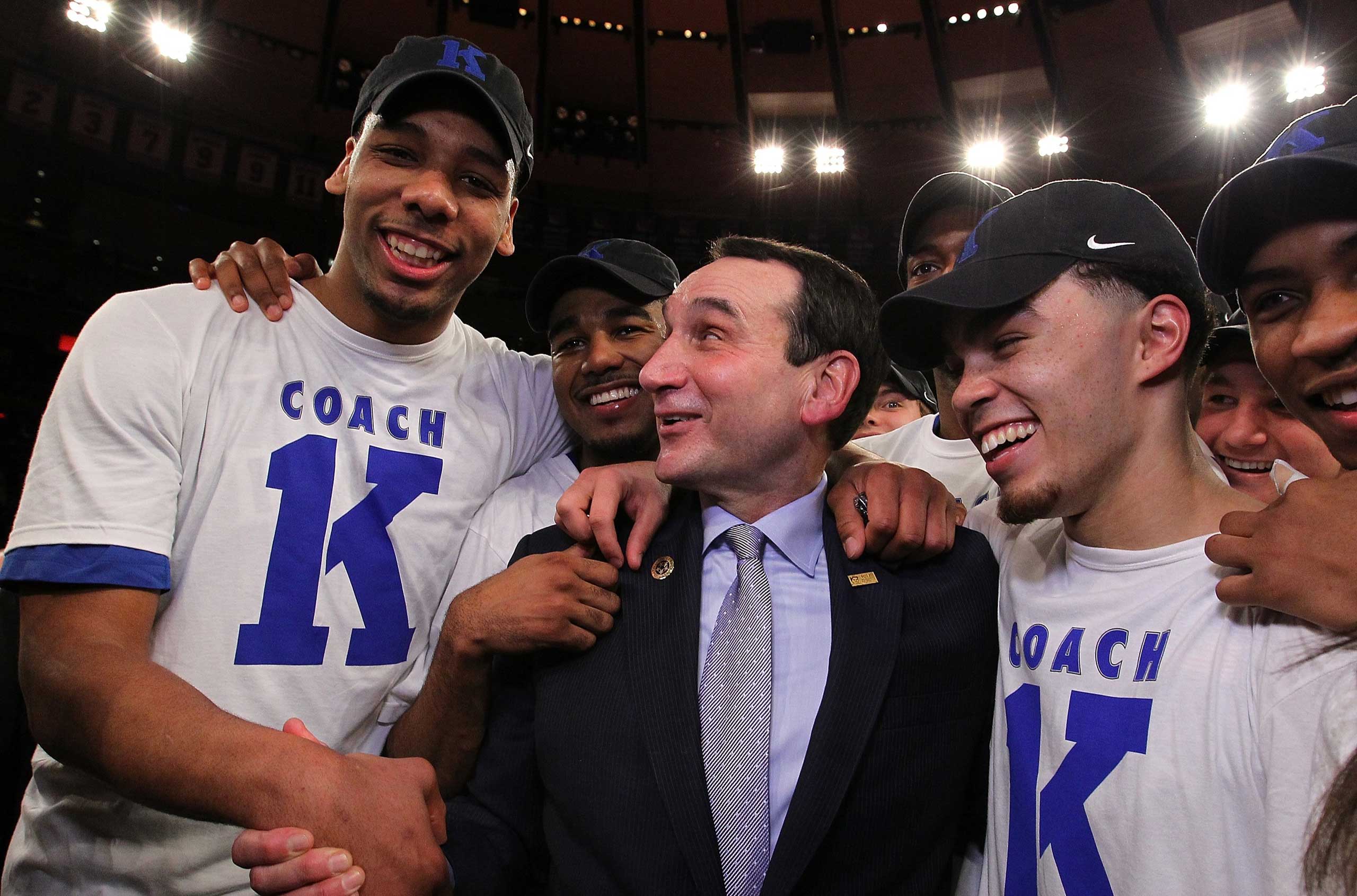 Head coach Mike Krzyzewski of the Duke Blue Devils celebrates with teamates after his 1000th career win after the game against the St. John's Red Storm at Madison Square Garden on January 25, 2015 in New York City. (Nate Shron&mdash;Getty Images)