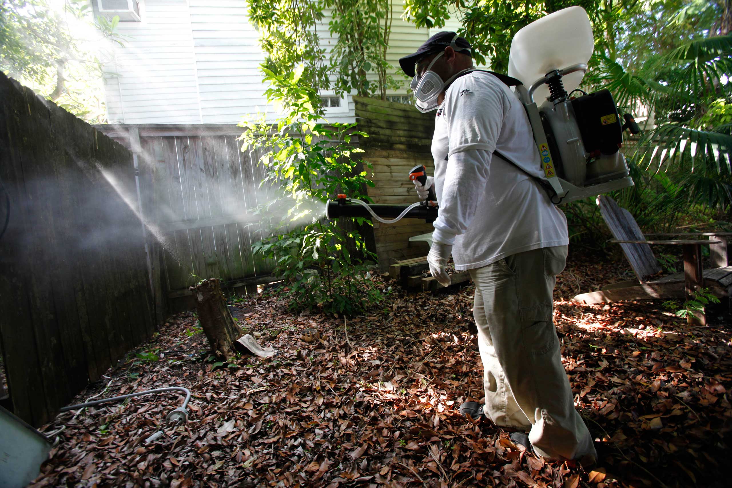 Jason Garcia, a field inspector with the Florida Keys Mosquito Control District, tests a sprayer that could be used in the future to spray pesticides to control mosquitos in Key West, Fla., on Oct. 4, 2012 (Wilfredo Lee—AP)