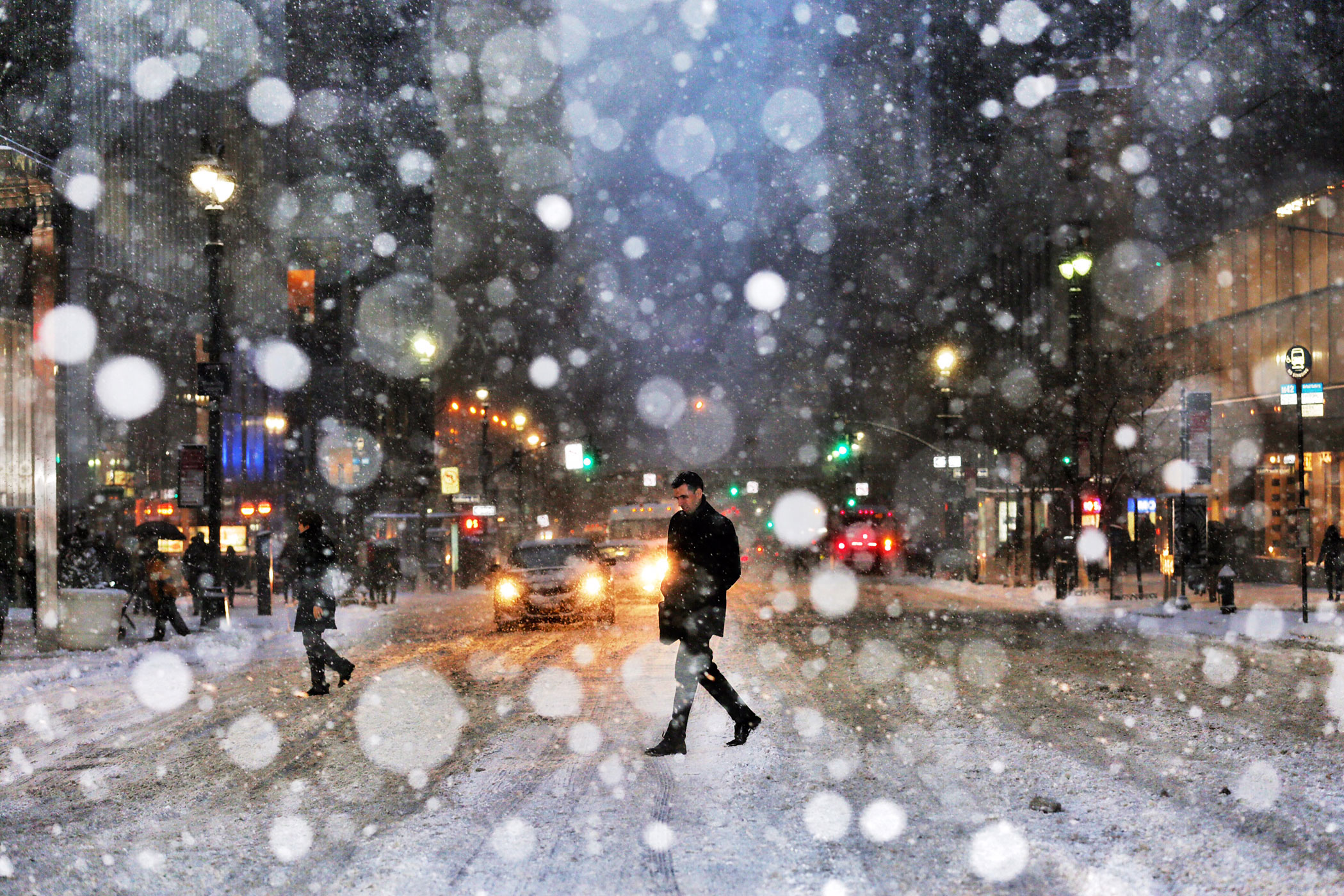A man crosses the street in New York City during a snow storm in New York City on Jan. 26, 2015. (Benjamin Lowy—Getty Images Reportage for TIME)