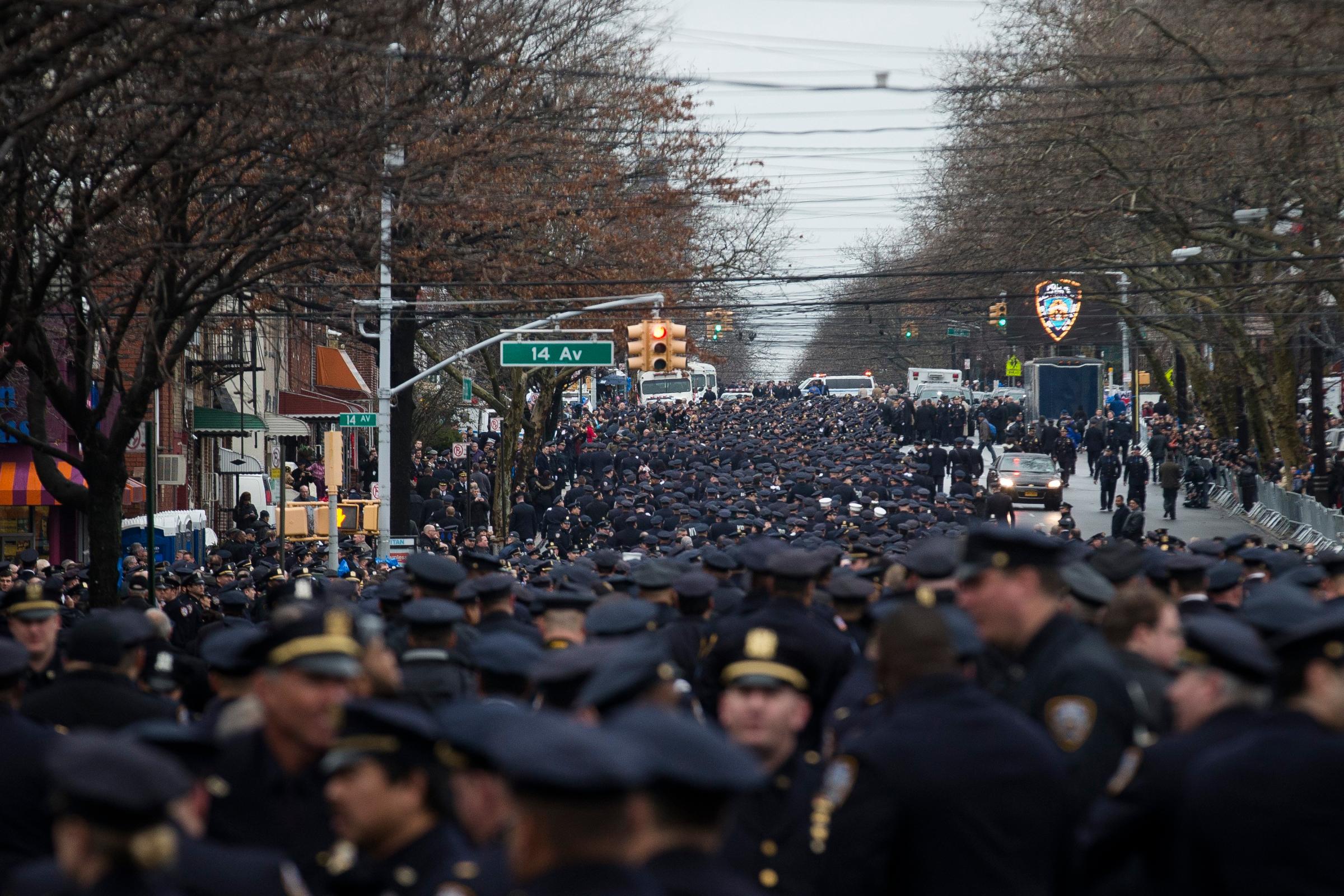 Police officers from across the country gather for the funeral of New York Police Department Officer Wenjian Liu at Aievoli Funeral Home on Jan. 4, 2015, in the Brooklyn borough of New York.