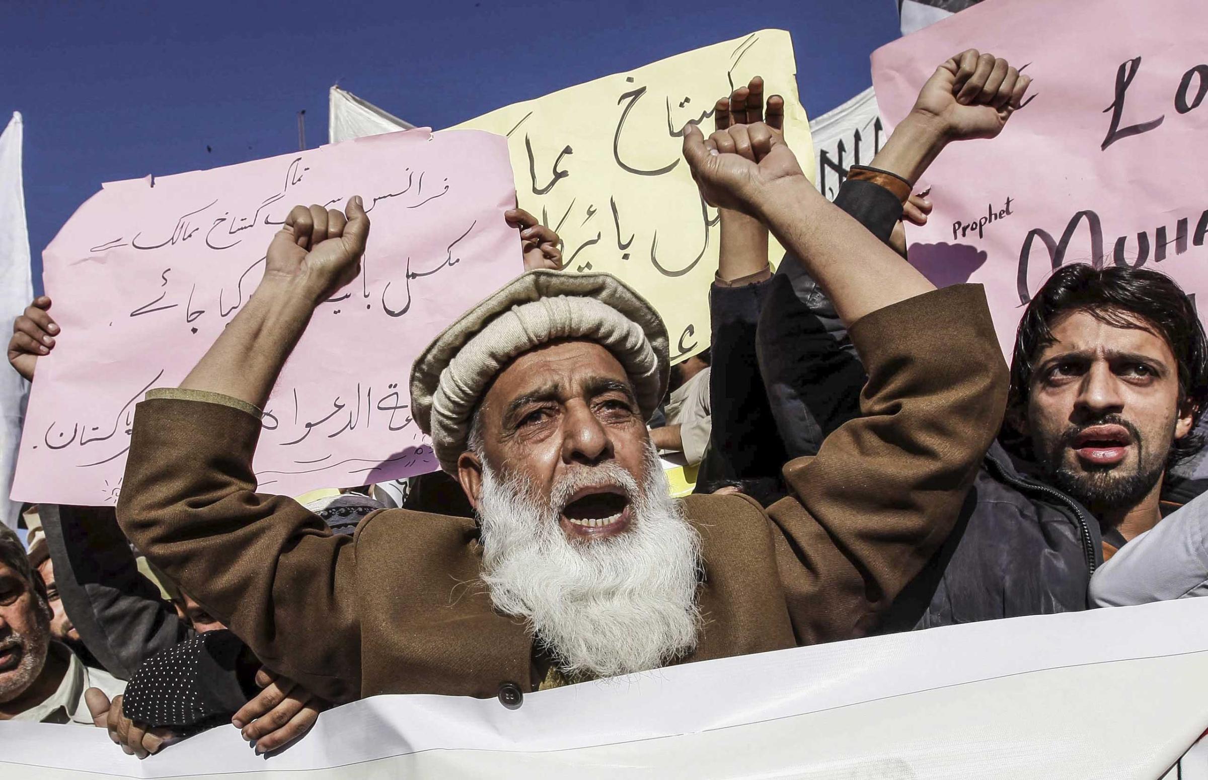 Supporters of banned Islamic charity Jamat-ud-Dawa protest controversial French magazine Charlie Hebdo's decision to publish a depiction of the Prophet Muhammad in Peshawar, Pakistan on Jan. 16, 2015.