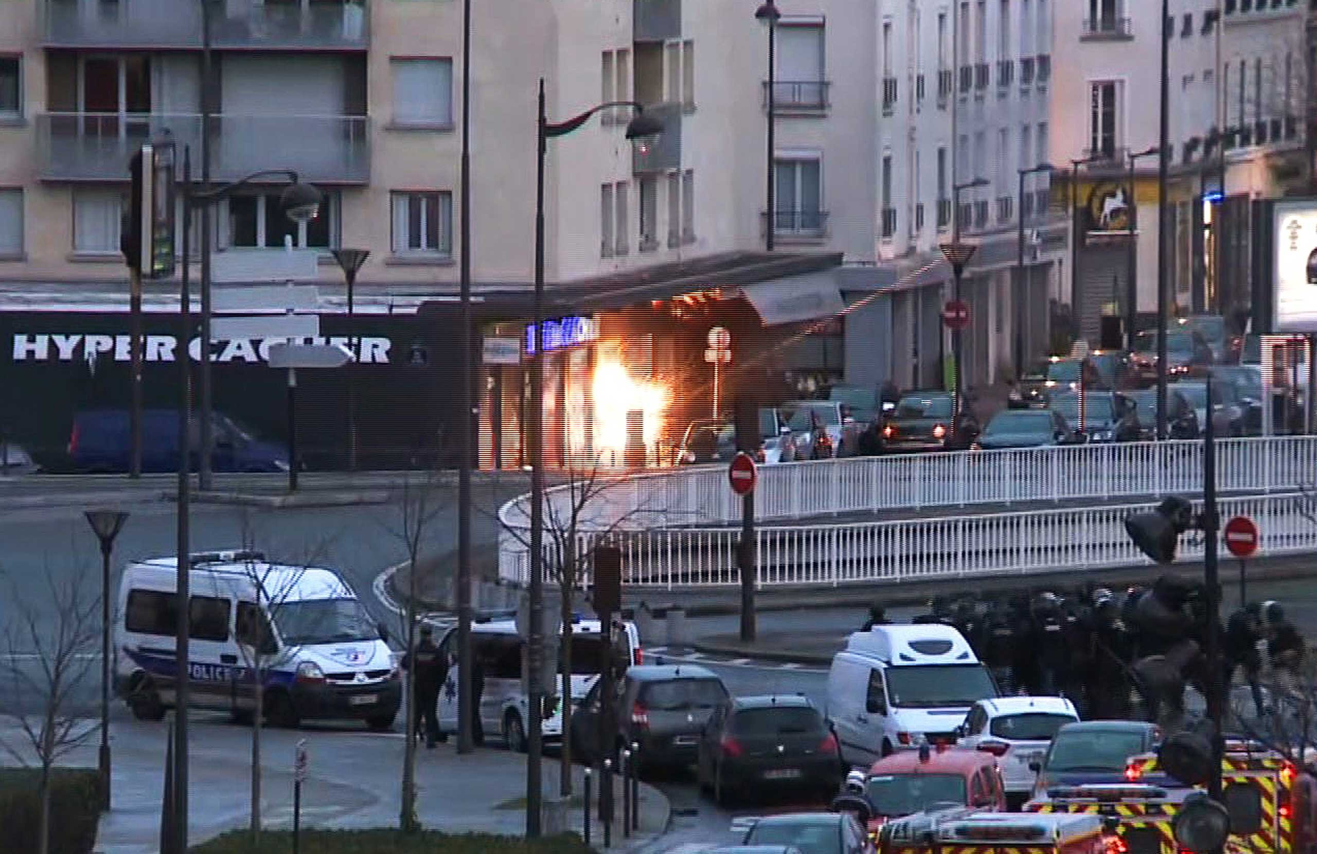 A screengrab taken from an AFP TV video shows a general view of members of the French police special forces launching the assault at a kosher grocery store in Porte de Vincennes, eastern Paris, on Jan. 9, 2015.