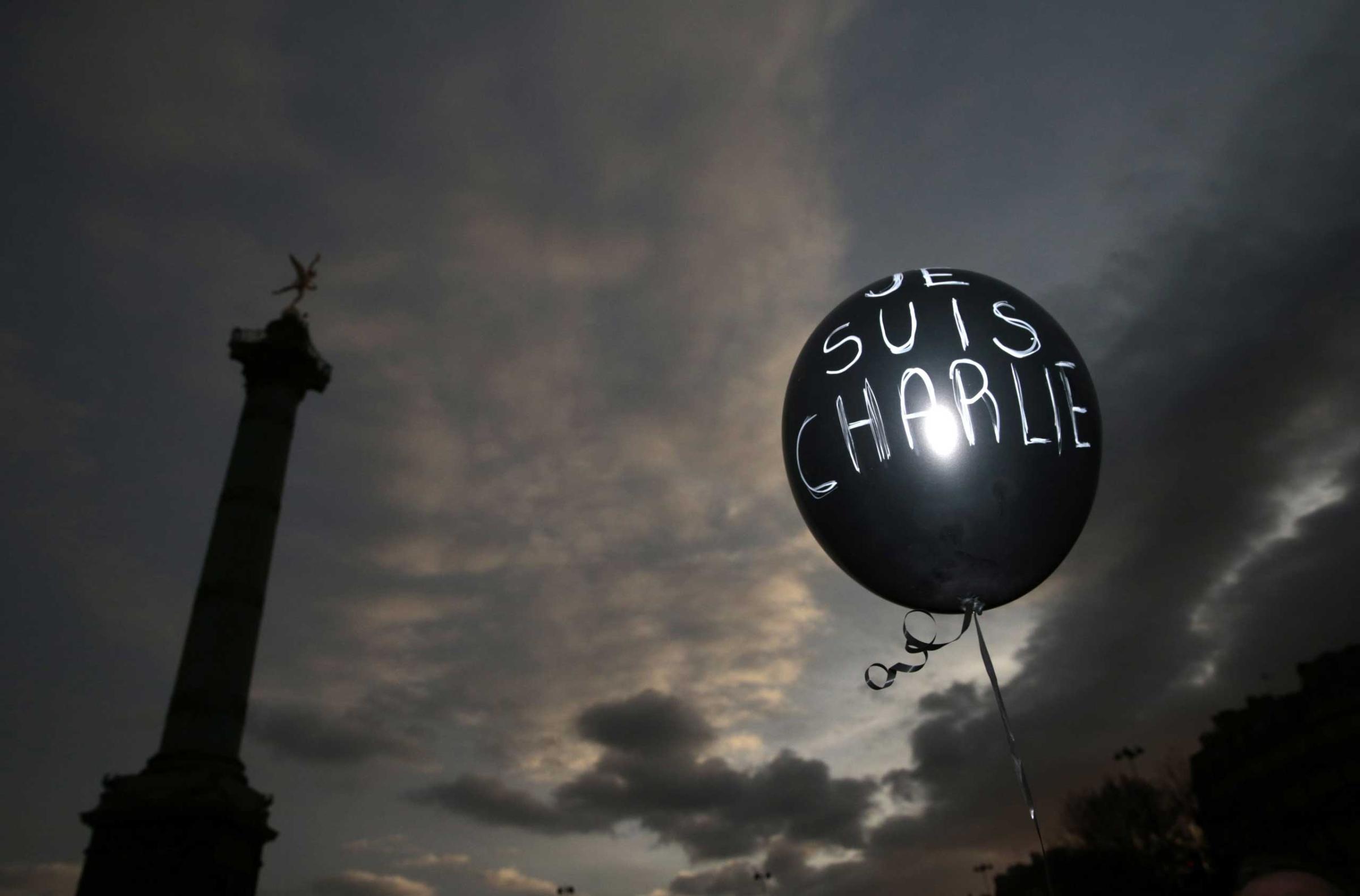 A balloon reading "Je suis Charlie" (I am Charlie) is held at Place de la Bastille during the solidarity march on Jan. 11, 2015 in Paris.