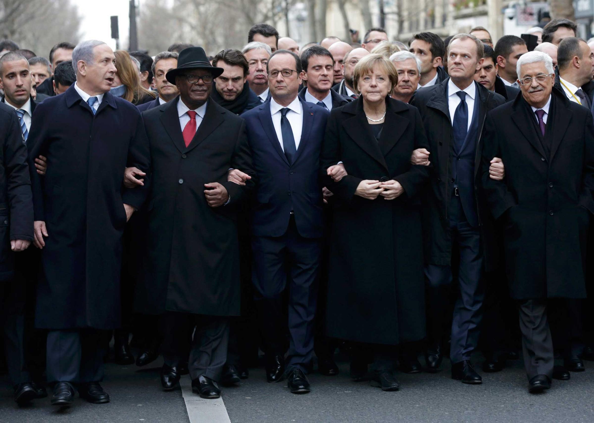 French President Francois Hollande is surrounded by head of states including Israel's Prime Minister Benjamin Netanyahu, Mali's President Ibrahim Boubacar Keita, Germany's Chancellor Angela Merkel, European Council President Donald Tusk and Palestinian President Mahmoud Abbas as they attend the solidarity march in the streets of Paris Jan. 11, 2015.