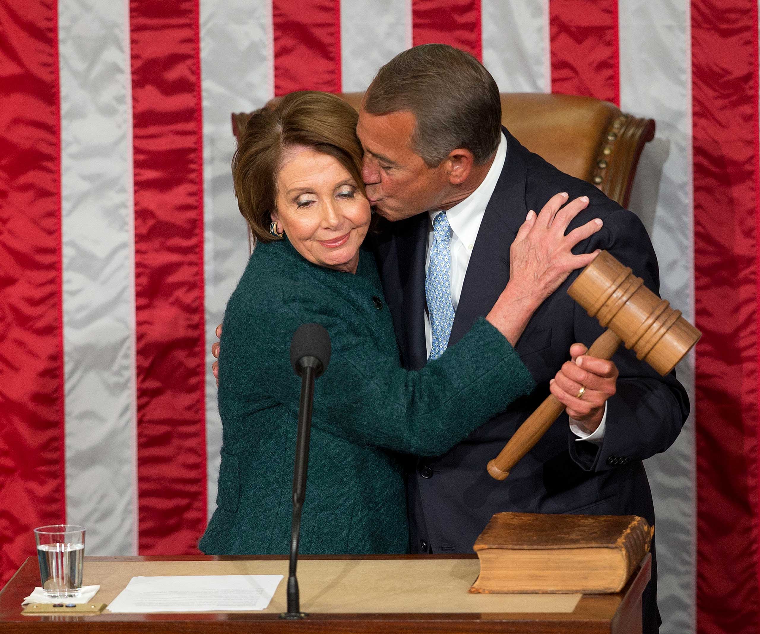 House Speaker John Boehner of Ohio, kisses House Minority Leader Nancy Pelosi of Calif. after being re-elected to a third term during the opening session of the 114th Congress on Capitol Hill in Washington on Jan. 6, 2015. (Pablo Martinez Monsivais—AP)