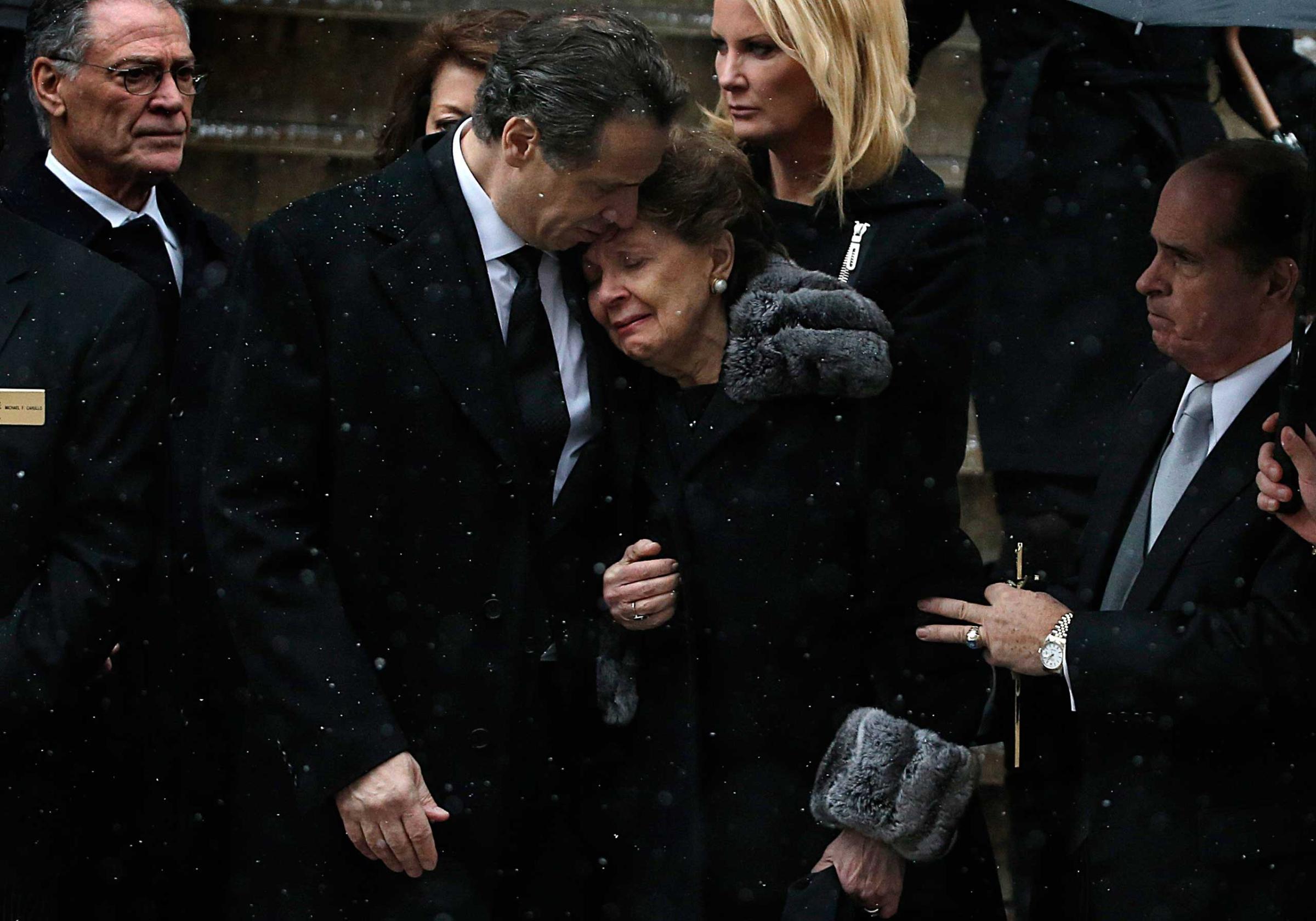 Jan. 6, 2015. New York Governor Andrew Cuomo comforts his mother Matilda outside the St. Ignatius Loyola Church after a funeral service for his late father, former Governor Mario Cuomo, in New York.