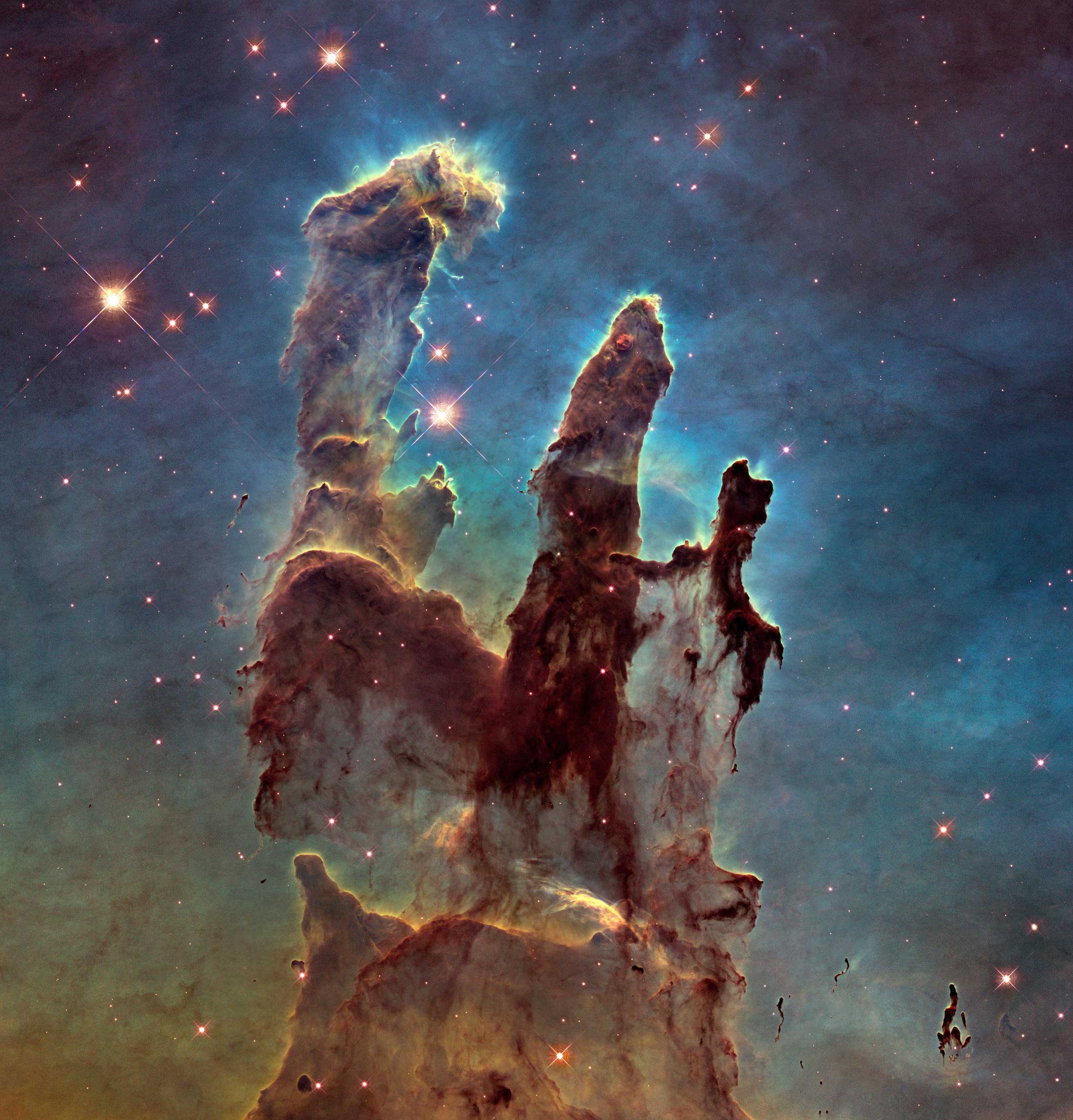 Jan. 5,  2015. To mark the 25th anniversary of the Hubble Telescope, NASA has revisited the famous Pillars of Creation, revealing a sharper and wider view of the structures in this visible-light image.