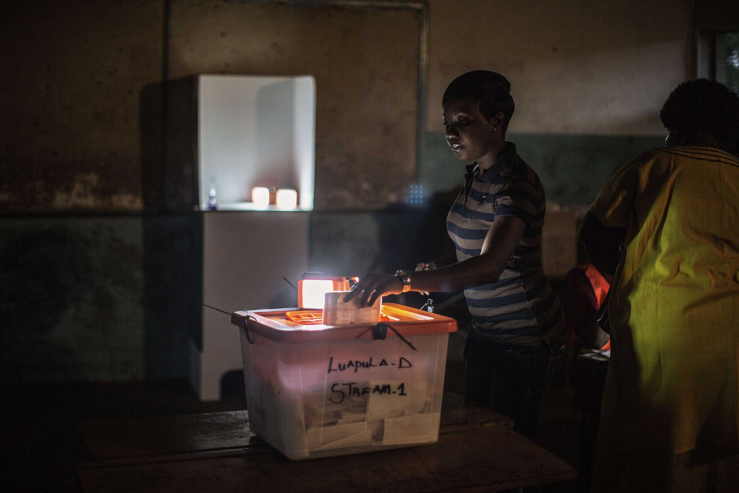 Jan. 20, 2015. A Zambian woman casts her ballot for the presidential elections at a voting station in Lusaka, Zambia. One of the frontrunners in Zambia's presidential election cried fraud just hours after polling stations opened in a tight race to replace Michael Sata, who died in office last year.