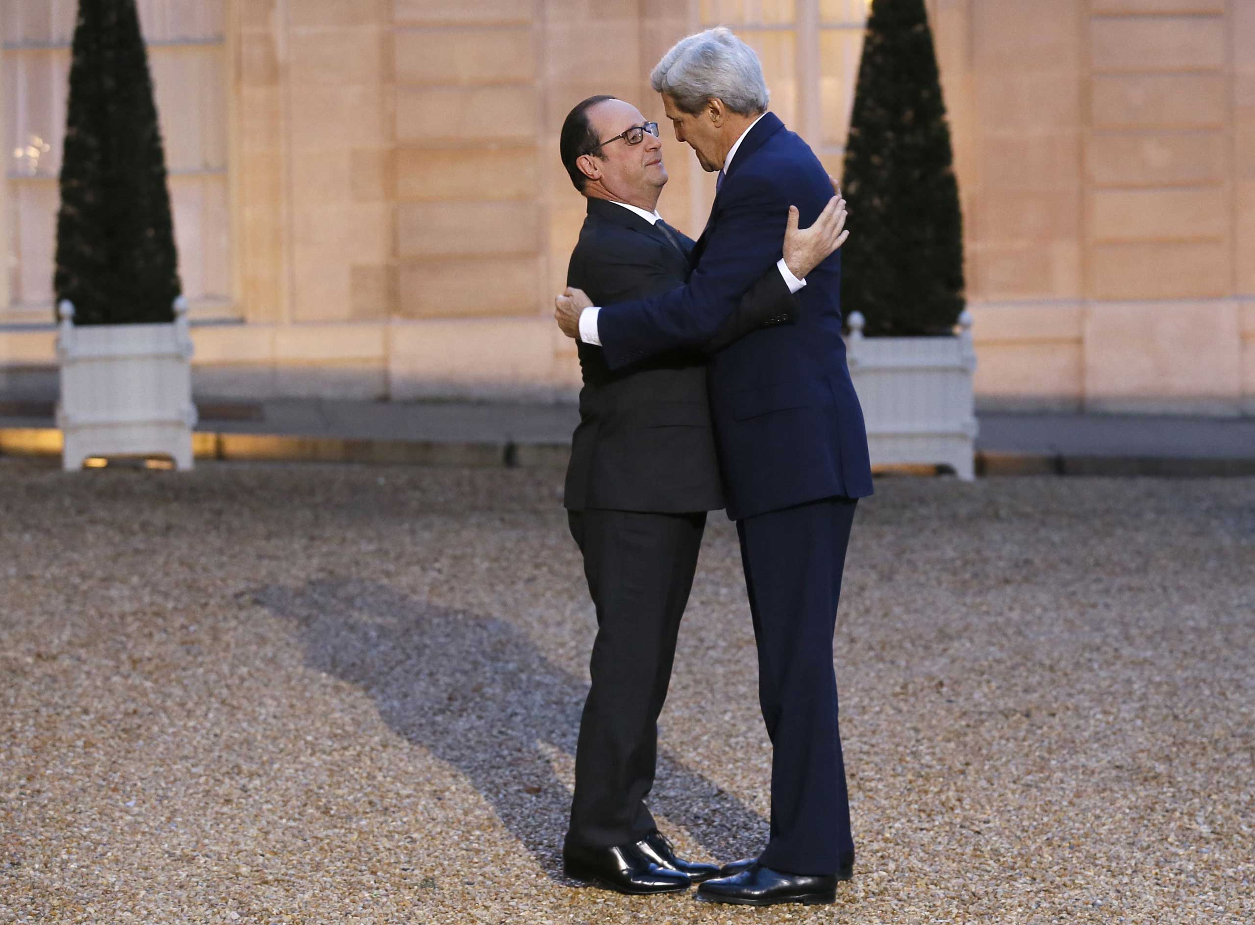 Jan. 16, 2015. French President Francois Hollande (L) embraces U.S. Secretary of State John Kerry prior to a meeting at the Elysee Palace in Paris. Kerry's visit came after criticism of the U.S. for not sending a top-level representative to a march in Paris that drew 1.5 million people and dozens of world leaders in the wake of the attacks.