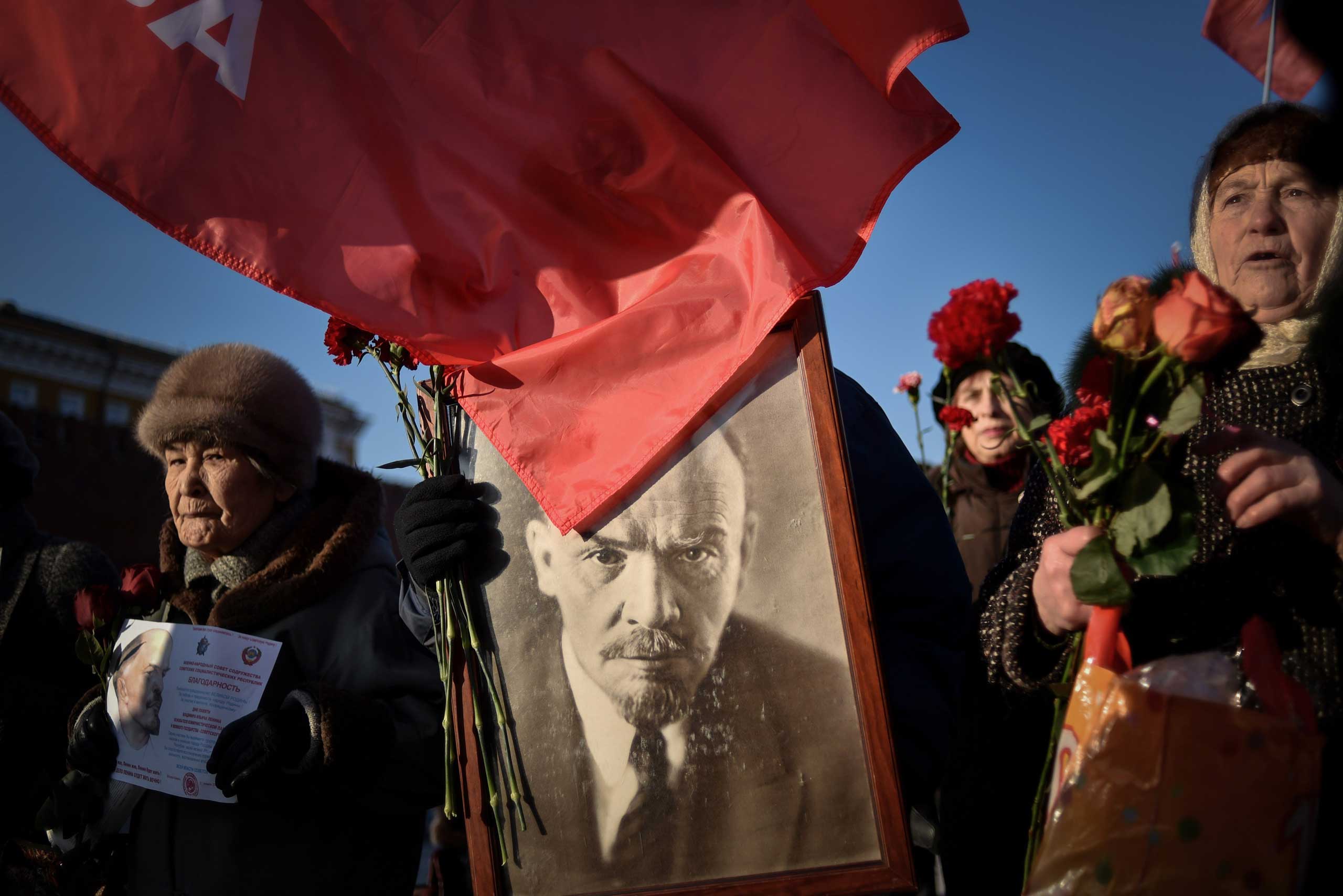 Jan. 21, 2015. Russian Communist Party supporters carry a portrait of late Soviet leader Vladimir Lenin as they take part in a memorial ceremony to mark the 91st anniversary of his death at Red Square in central Moscow.