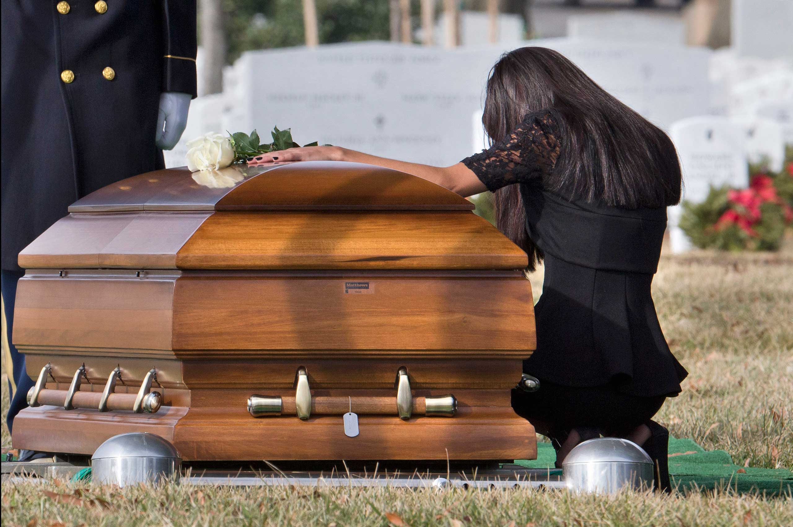 Jan. 23, 2015. Christina Strange mourns after laying a white rose on the casket for her fiancé, Army Sgt. 1st Class Ramon S. Morris, of New York City, during his burial services at Arlington National Cemetery in Arlington, Va. Morris died in Parwan Province, Afghanistan, of wounds suffered when the enemy attacked his vehicle with an improvised explosive device. Strange is the mother of Morris' three-year-daughter.