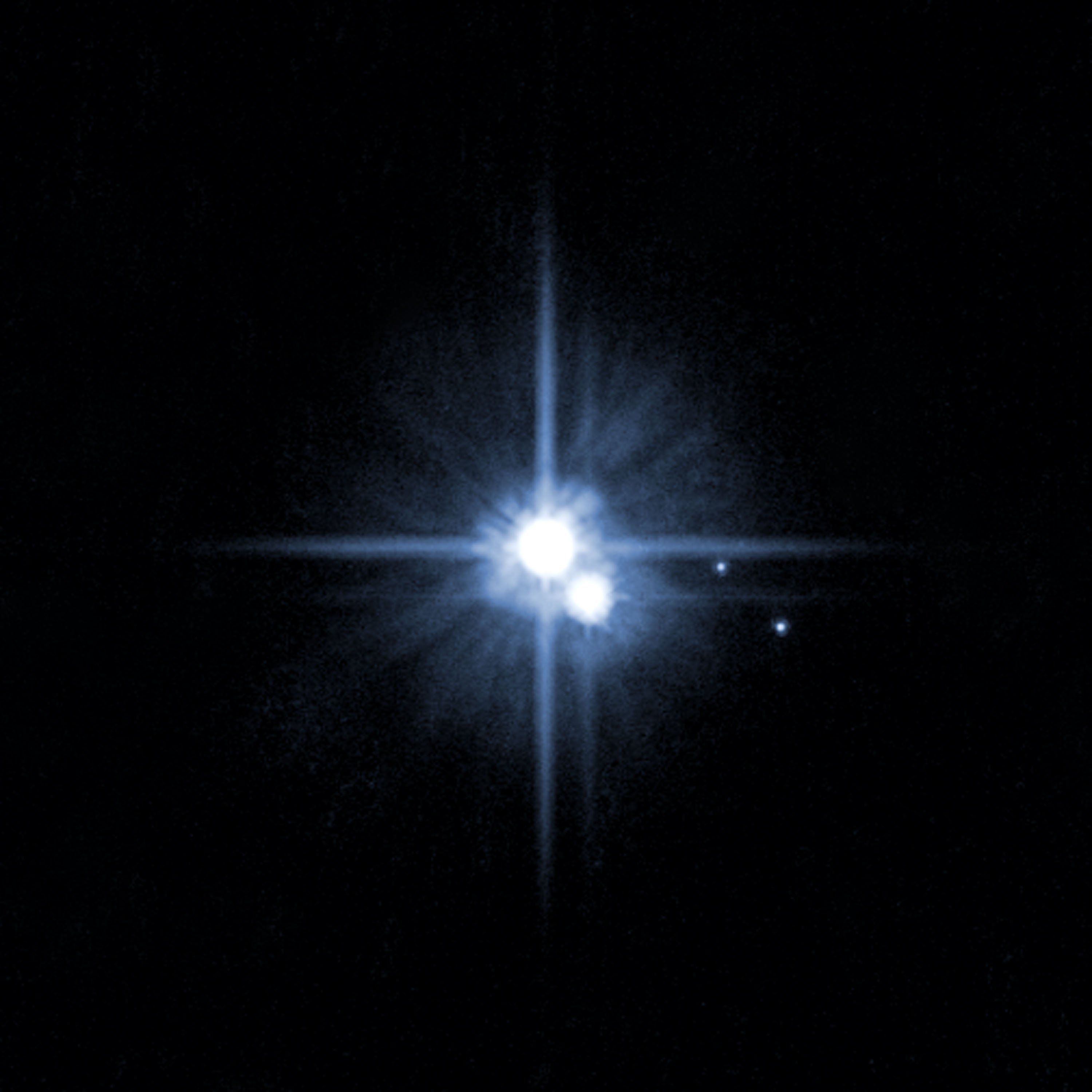 Pluto and three of its moons, photographed by the Hubble Space Telescope (NASA/Getty Images)