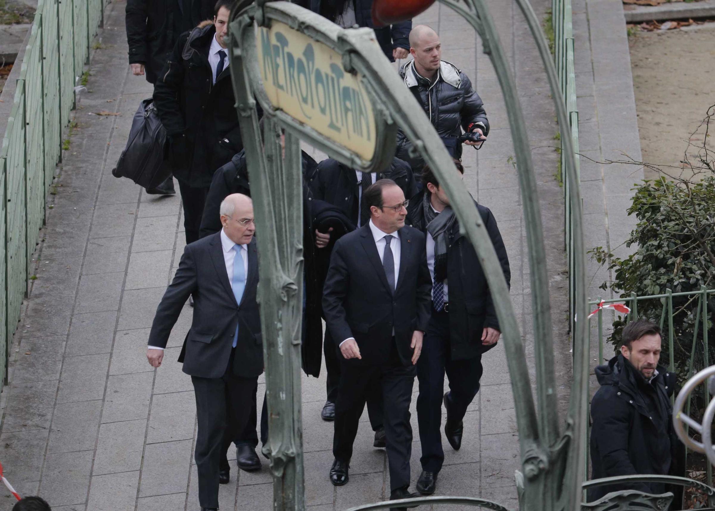 President Francois Hollande arrives after a shooting at the Paris offices of Charlie Hebdo, a satirical newspaper, Jan. 7, 2015.