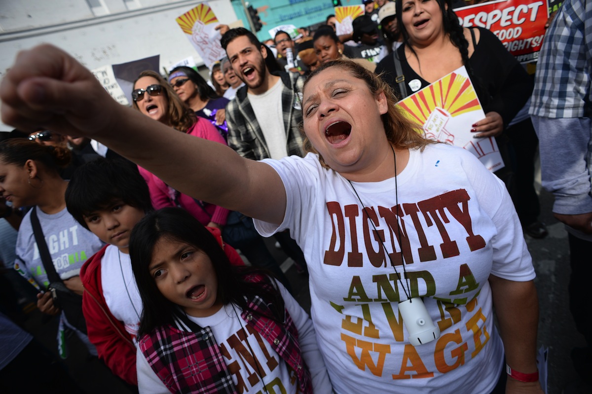 Fast food workers, healthcare workers and their supporters march to demand an increase of the minimum wage, in Los Angeles on Dec. 4, 2014 (Robyn Beck—AFP/Getty Images)