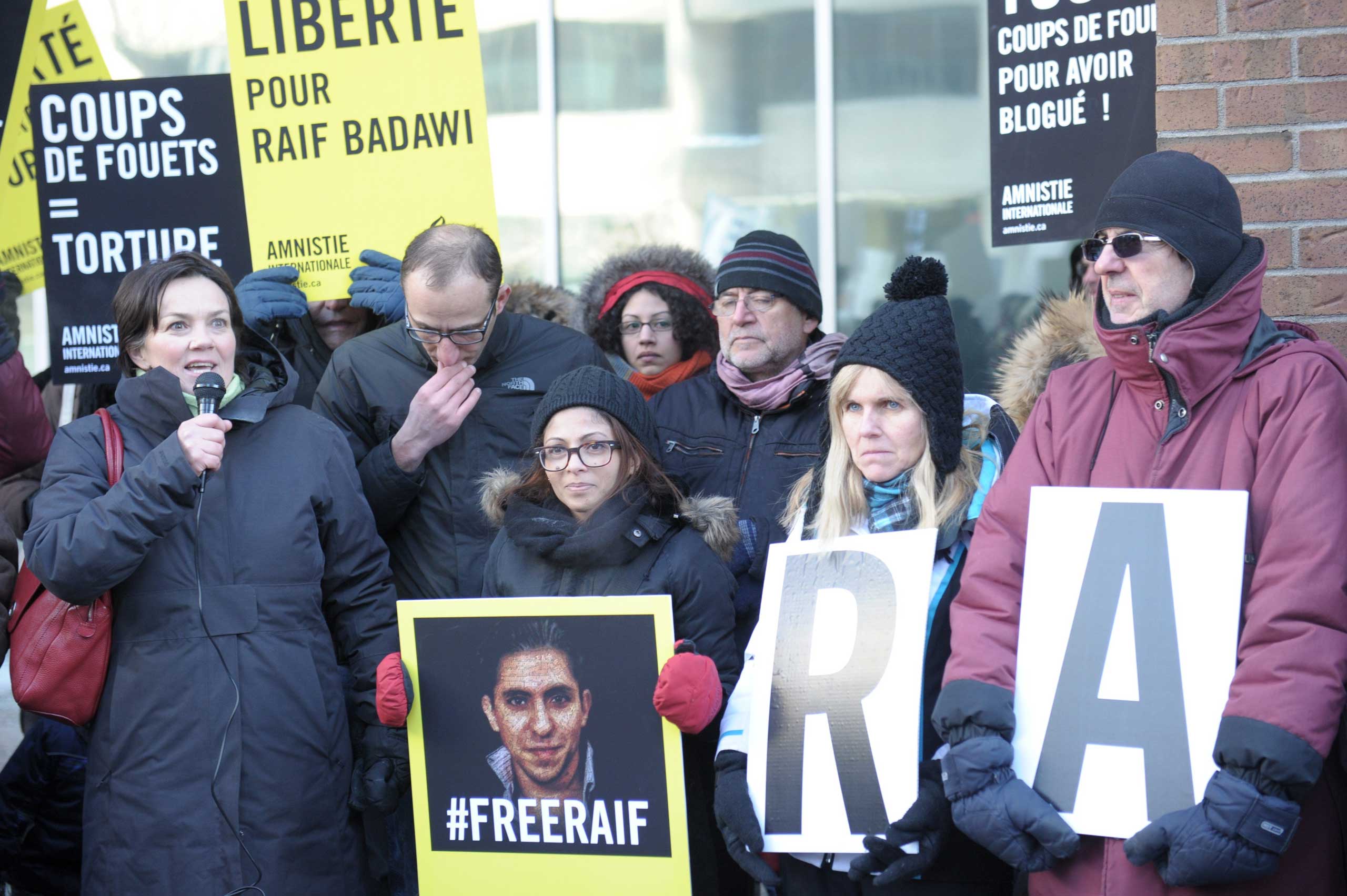 Ensaf Haidar (C), the wife of the Saudi Blogger Raif Badawi, holds a vigil urging Saudi Arabia to free her husband in Montreal on Jan. 13, 2015. (Clement Sabourin—AFP/Getty Images)