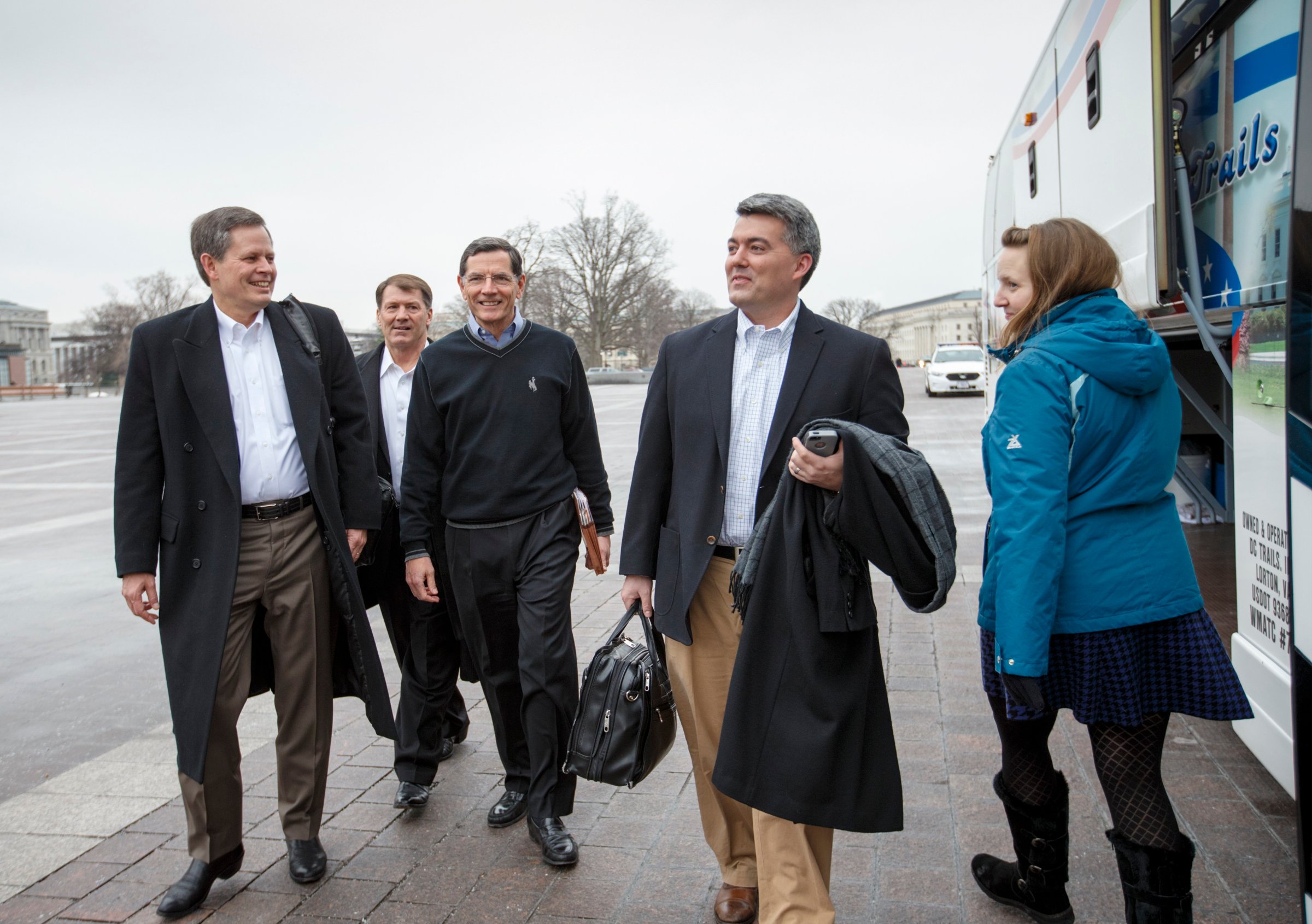 From left, Sen. Steve Daines, R-Mont., Sen. Mike Rounds, R-S.D., Sen. John Barrasso, R-Wyo., and Sen. Cory Gardner, R-Colo., prepare to board a tour bus to join Senate and House Republicans at a two-day policy retreat in Hershey, Pa. on Jan. 14, 2015, in Washington.