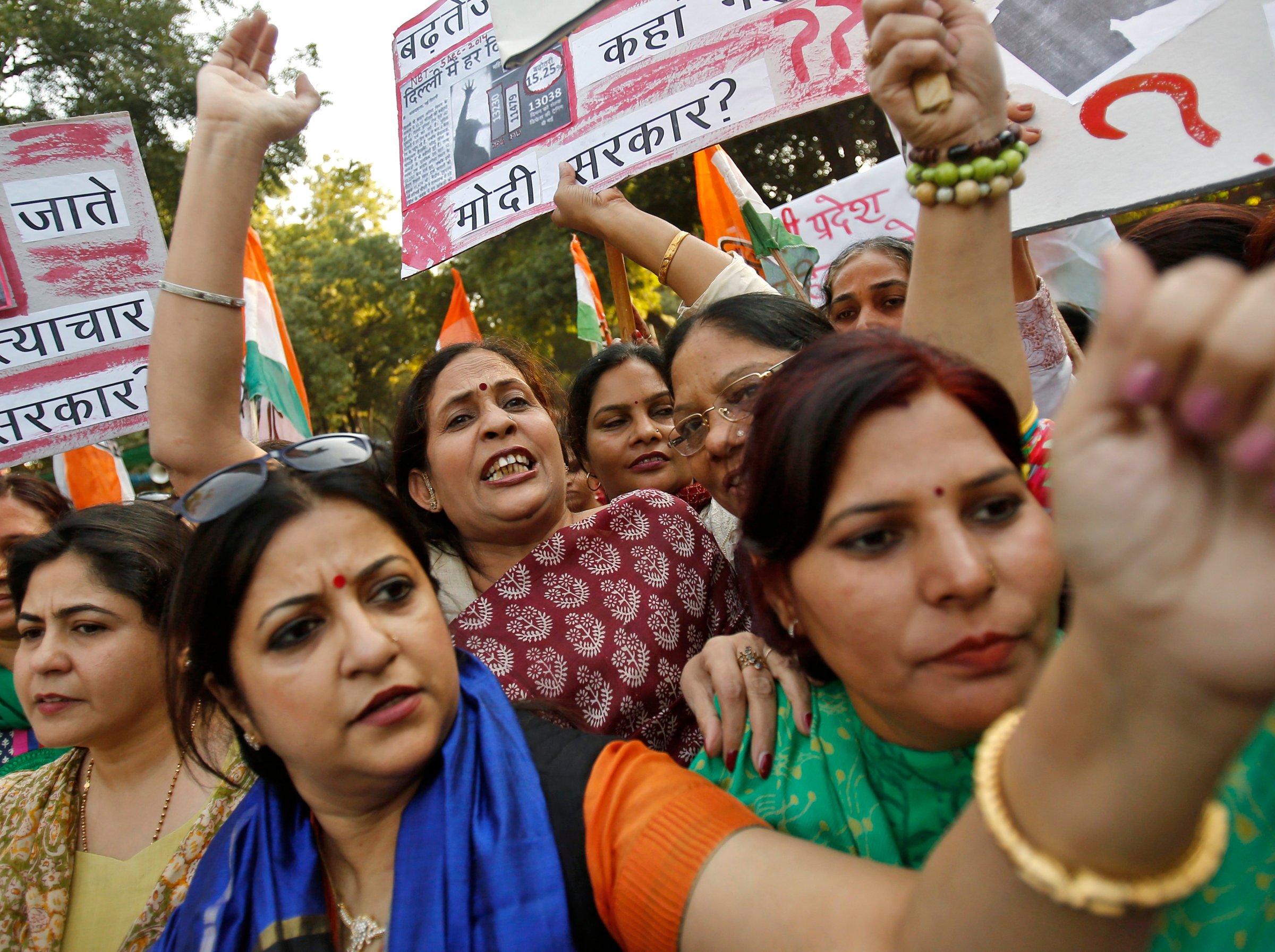 Members of All India Mahila Congress, women's wing of Congress party, shout slogans and carry placards during a protest against the rape of a female passenger, in New Delhi
