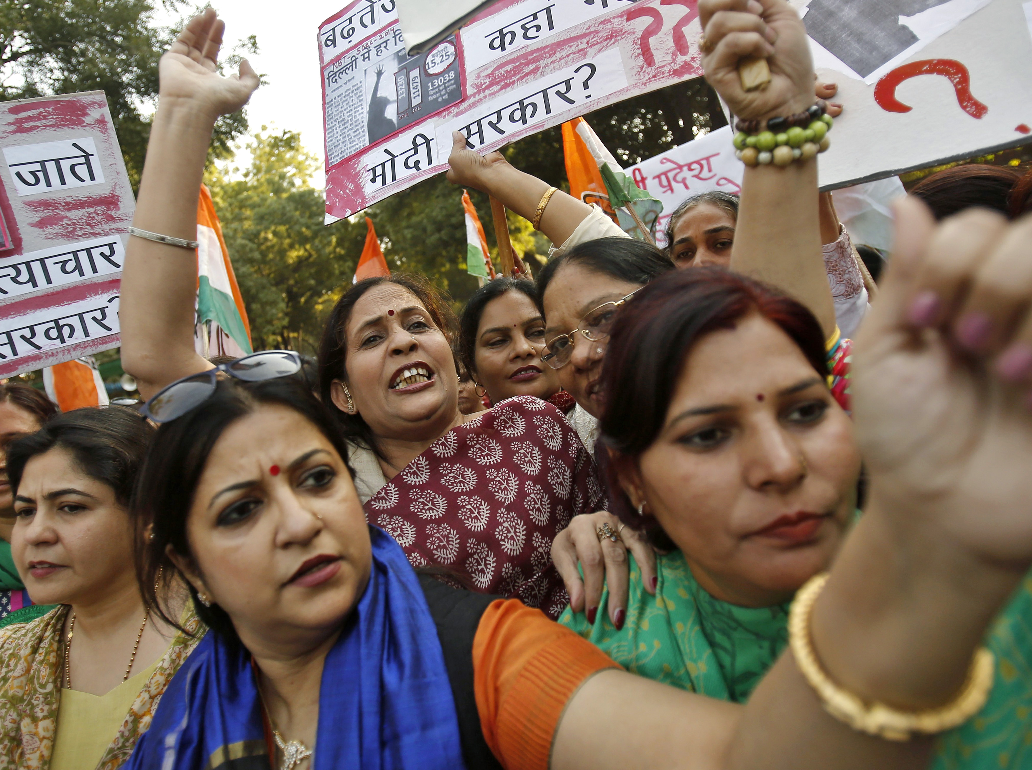 Members of All India Mahila Congress, women's wing of Congress party, shout slogans and carry placards during a protest against the rape of a female Uber passenger in New Delhi on Dec. 8, 2014 (Anindito Mukherjee—Reuters)