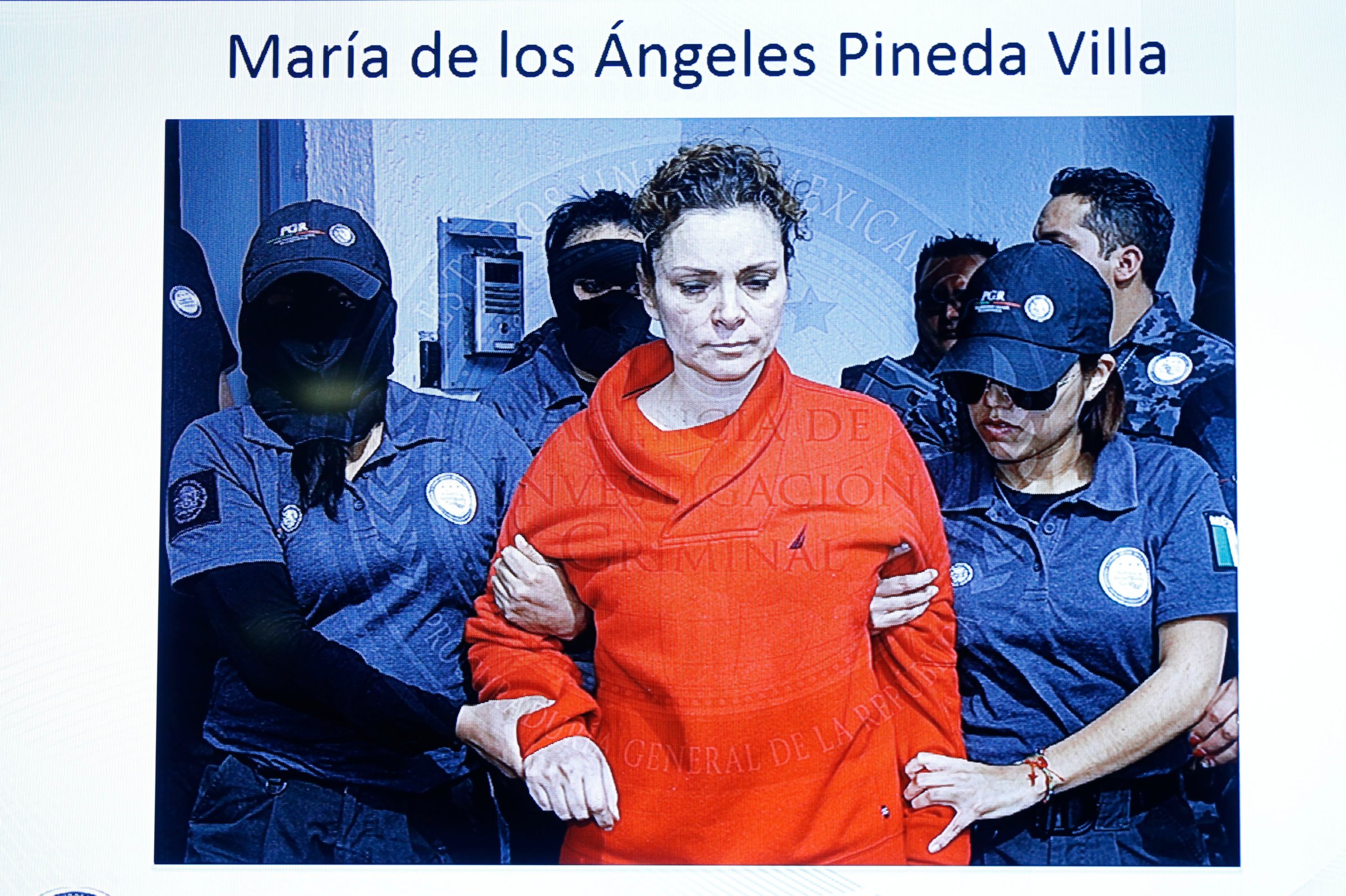 Handout of Maria de los Angeles Pineda Villa, the wife of former mayor of Iguala, Jose Luis Abarca, as seen displayed on a television screen during a news conference, while she is transferred to a prison in Nayarit town, in Mexico City