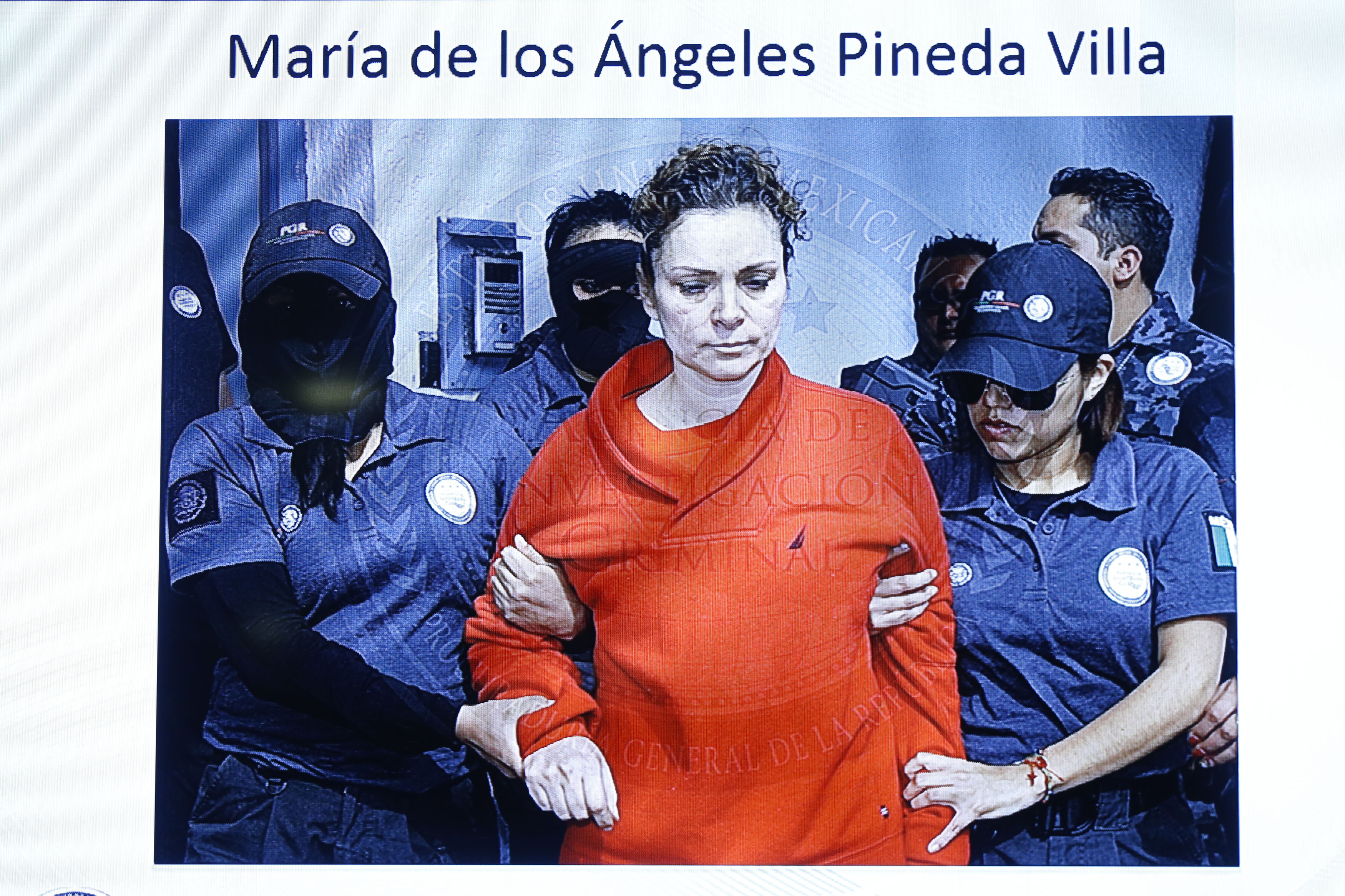 Mar&iacute;a de los &Aacute;ngeles Pineda, the wife of former mayor of Iguala, Jos&eacute; Luis Abarca, on a television screen while she is transferred to a prison in Tepic, in the Mexican state of Nayarit, in this handout picture released Jan. 5, 2015, by Mexico's Attorney General's Office (Handout—Reuters)