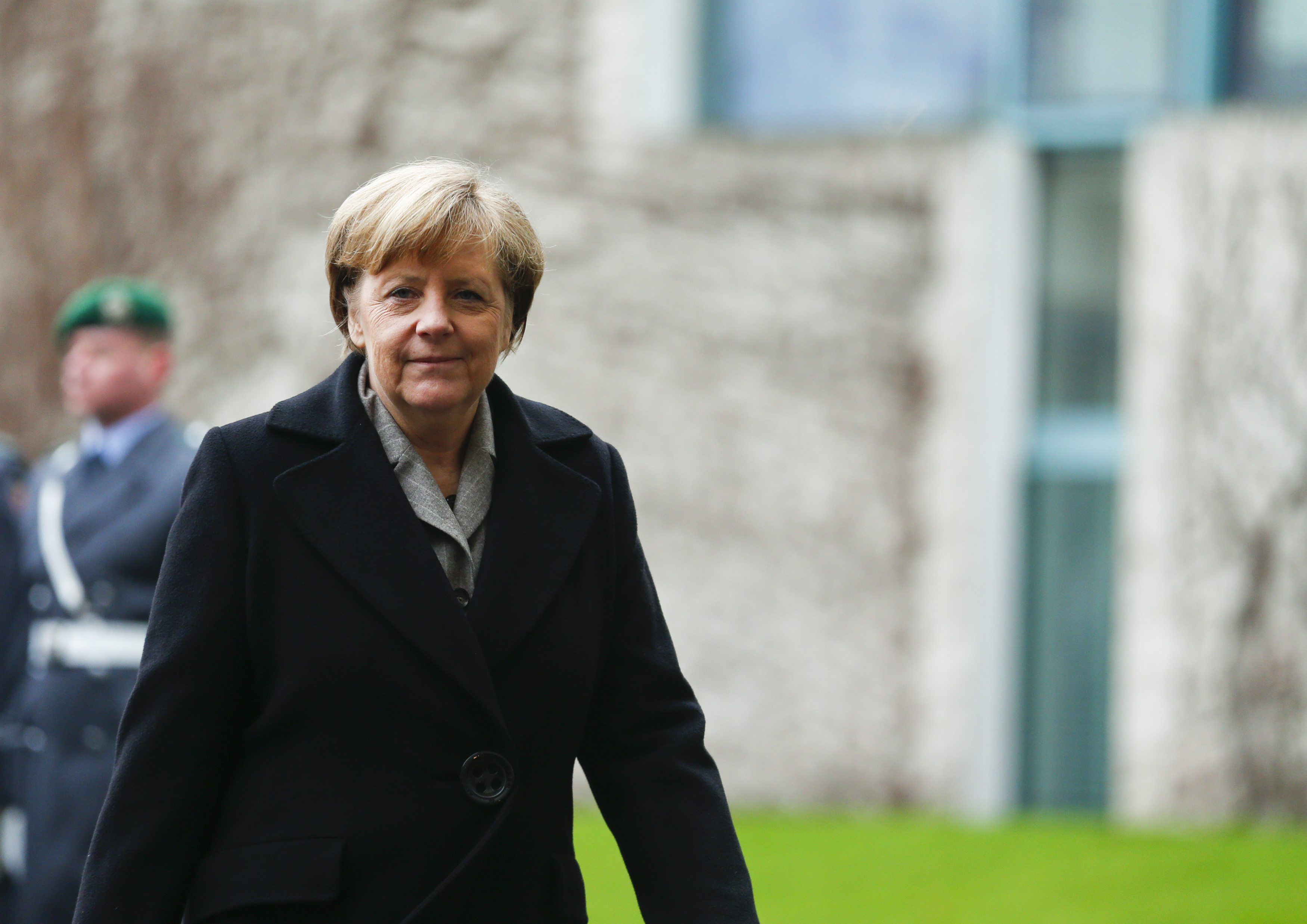 German Chancellor Merkel arrives to attend a welcoming ceremony for Turkish Prime Minister Davutoglu in Berlin