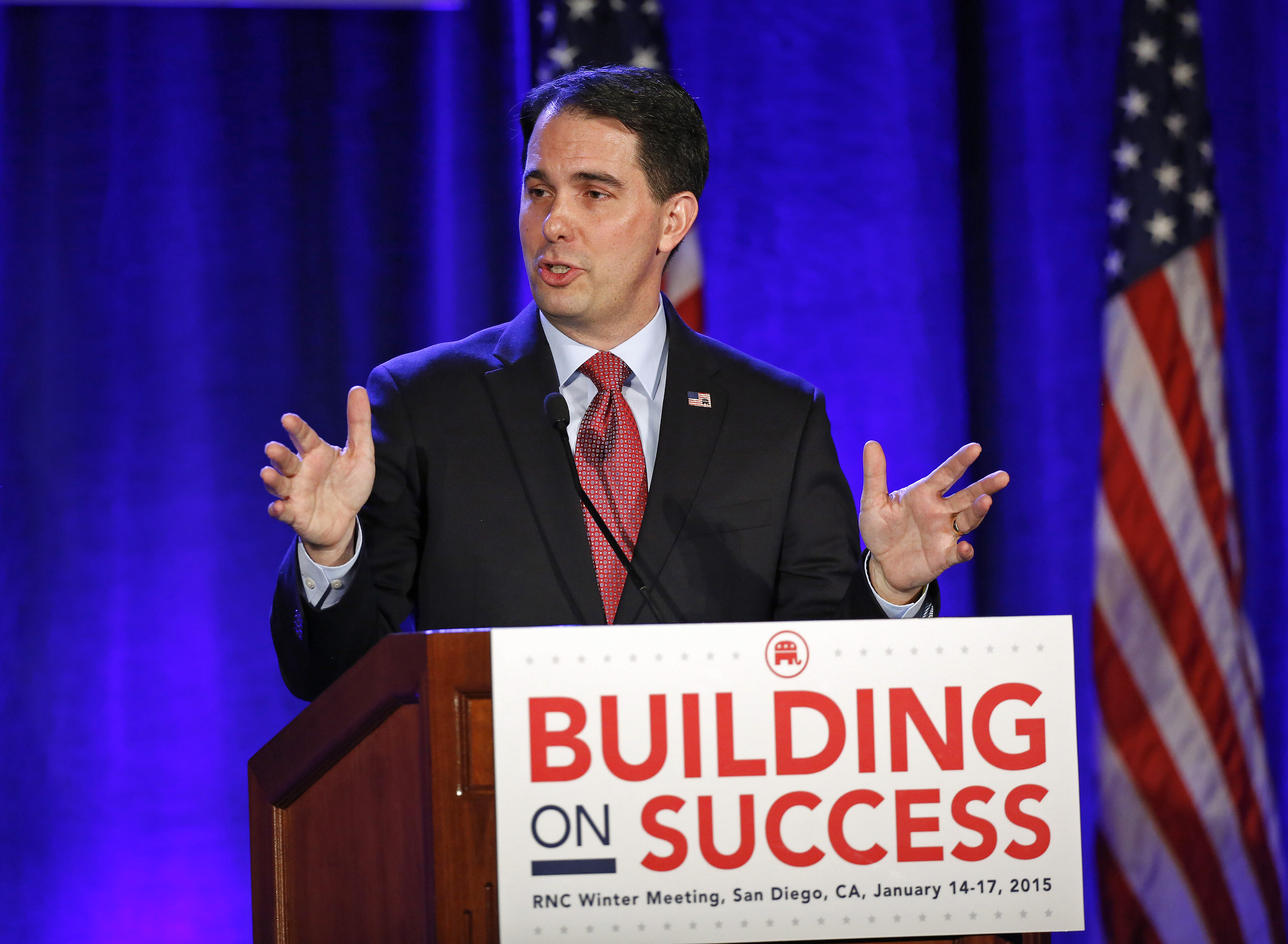 Wisconsin Governor Scott Walker takes the stage to address fellow Republicans at a dinner during the Republican National Committtee's "Building on Success" winter meeting in San Diego on Jan. 15, 2015 (Earnie Grafton—Reuters)