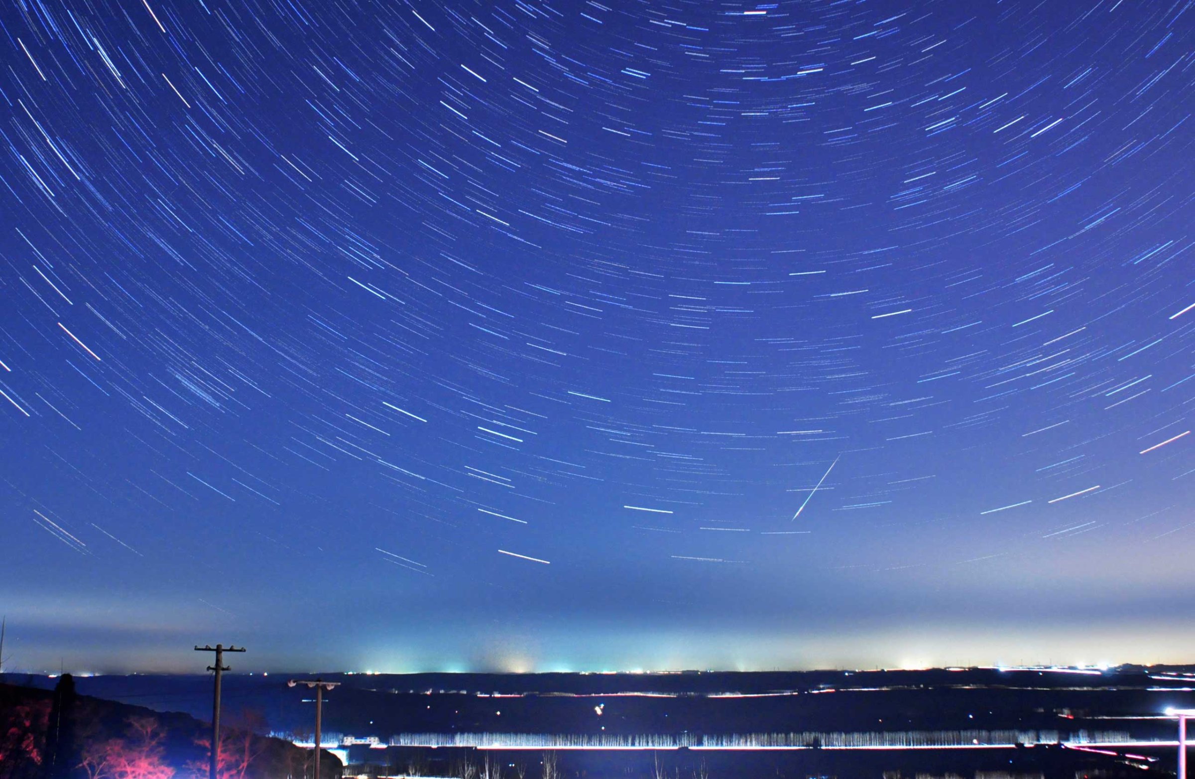 A meteor streaks past stars during the annual Quadrantid meteor shower in Qingdao