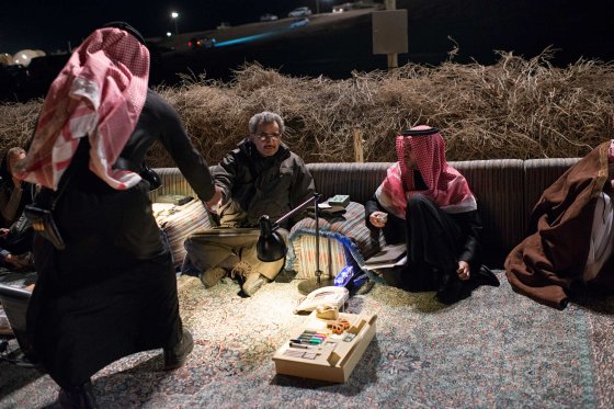 Billionaire HRH Prince Waleed bin Talal, greets Saudi citizens at a desert camp outside of Riyadh to accept their petitions for his help, in Saudi Arabia, February 27, 2013.   Like many families across Saudi Arabia who are barely scraping above the poverty line each month, many poor Saudis rely on the hope of the charity of others to survive. (Credit: Lynsey Addario/ VII)