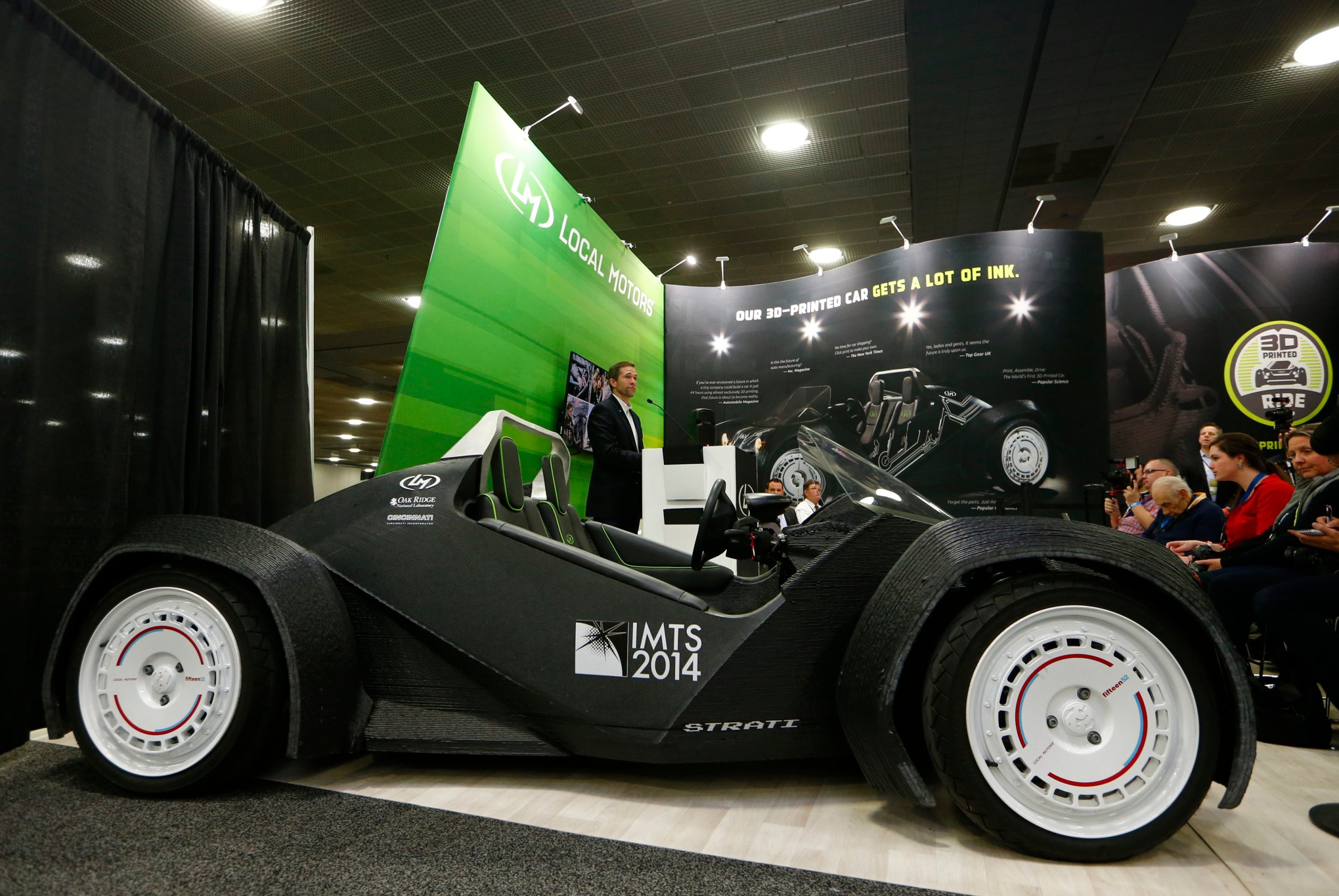 CEO and founder of Local Motors John B. Rogers speaks to the media as his company showcases the world's first 3-D printed car, the Strati, at the Detroit auto show on Jan. 12, 2015.