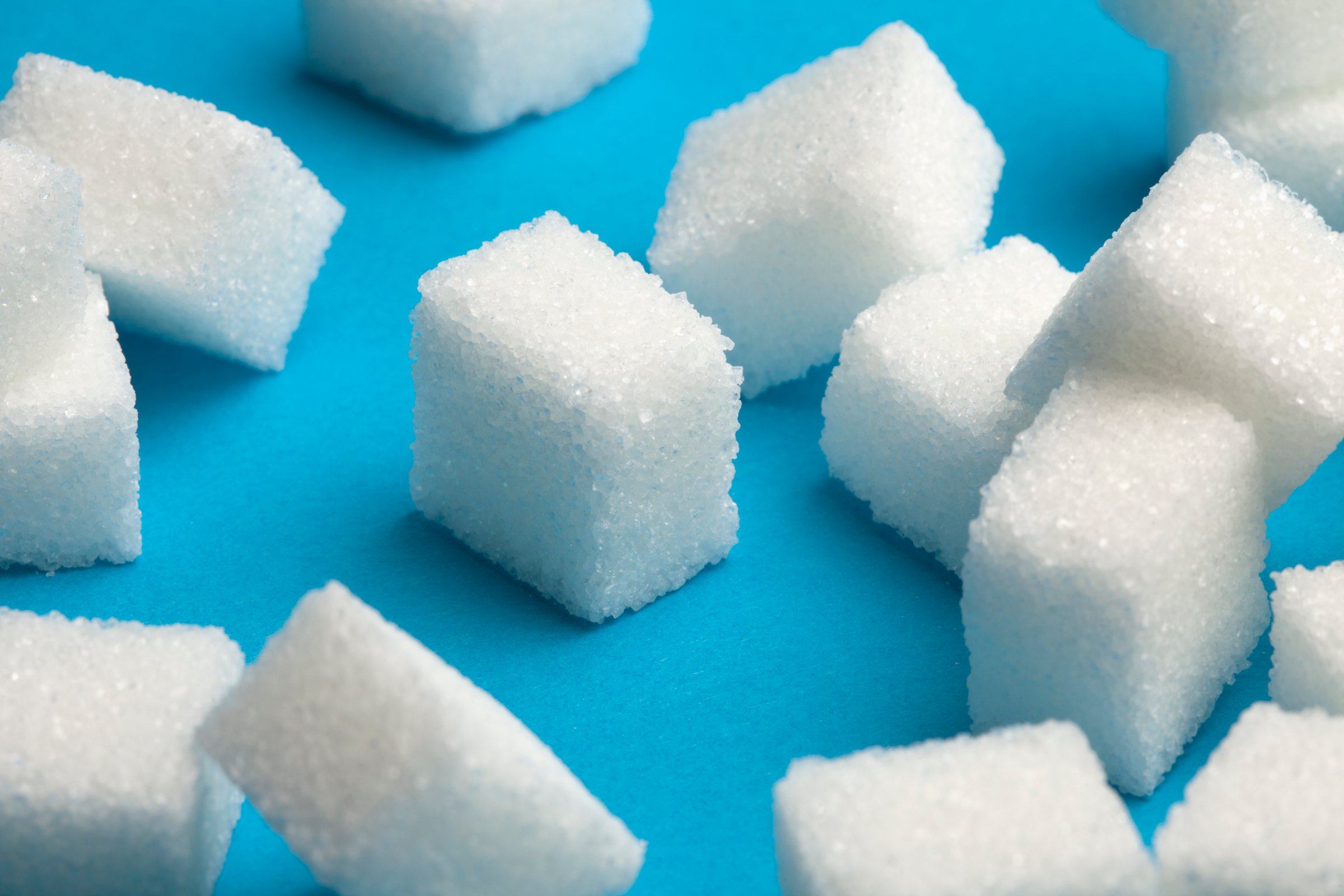 Sugar cubes with one standing out in the middle