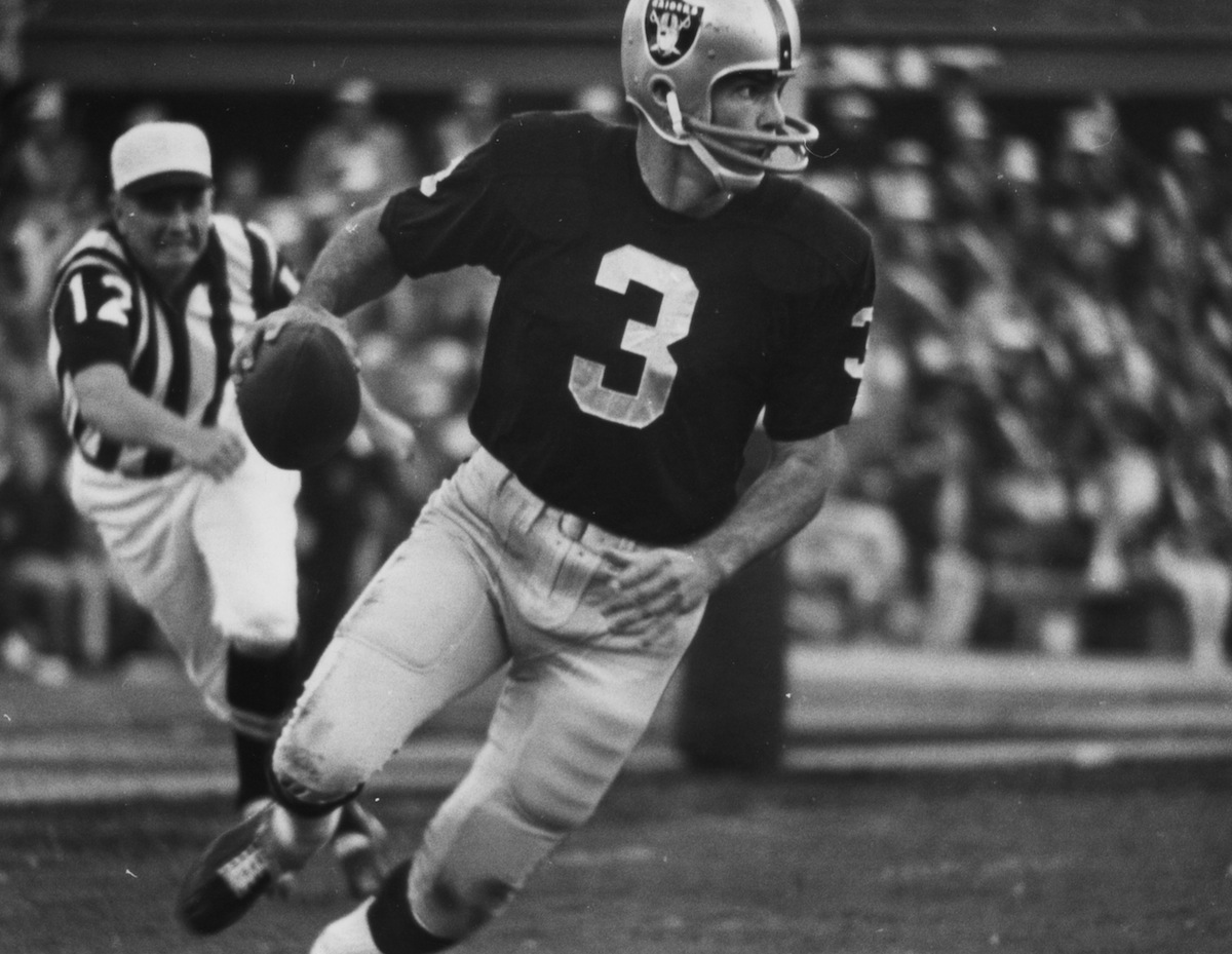 Oakland Raiders quarterback Daryle Lamonica (3) rolls out of the pocket during Super Bowl II, a 33-14 loss to the Green Bay Packers on Jan. 14, 1968, at the Orange Bowl in Miami, Fla. (Fred Roe—NFL/Getty Images)