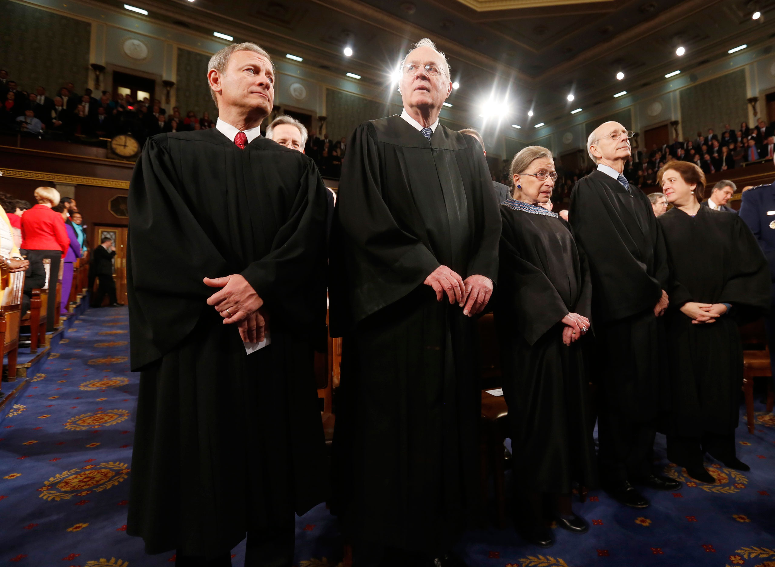 From left: U.S. Supreme Court Chief Justice John Roberts stands with fellow Justices Anthony Kennedy, Ruth Bader Ginsburg, Stephen Breyer and Elena Kagan prior to President Barack Obama's State of the Union speech on Capitol Hill in Washington, D.C. on  Jan. 28, 2014.