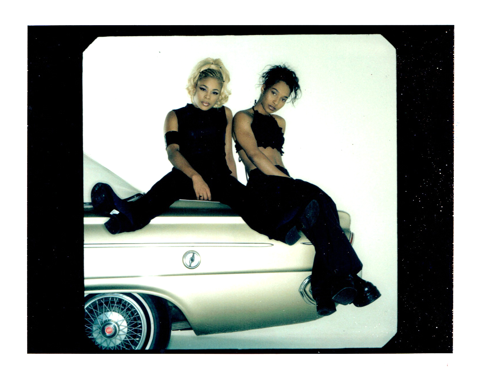 TBoz and Chilli on car