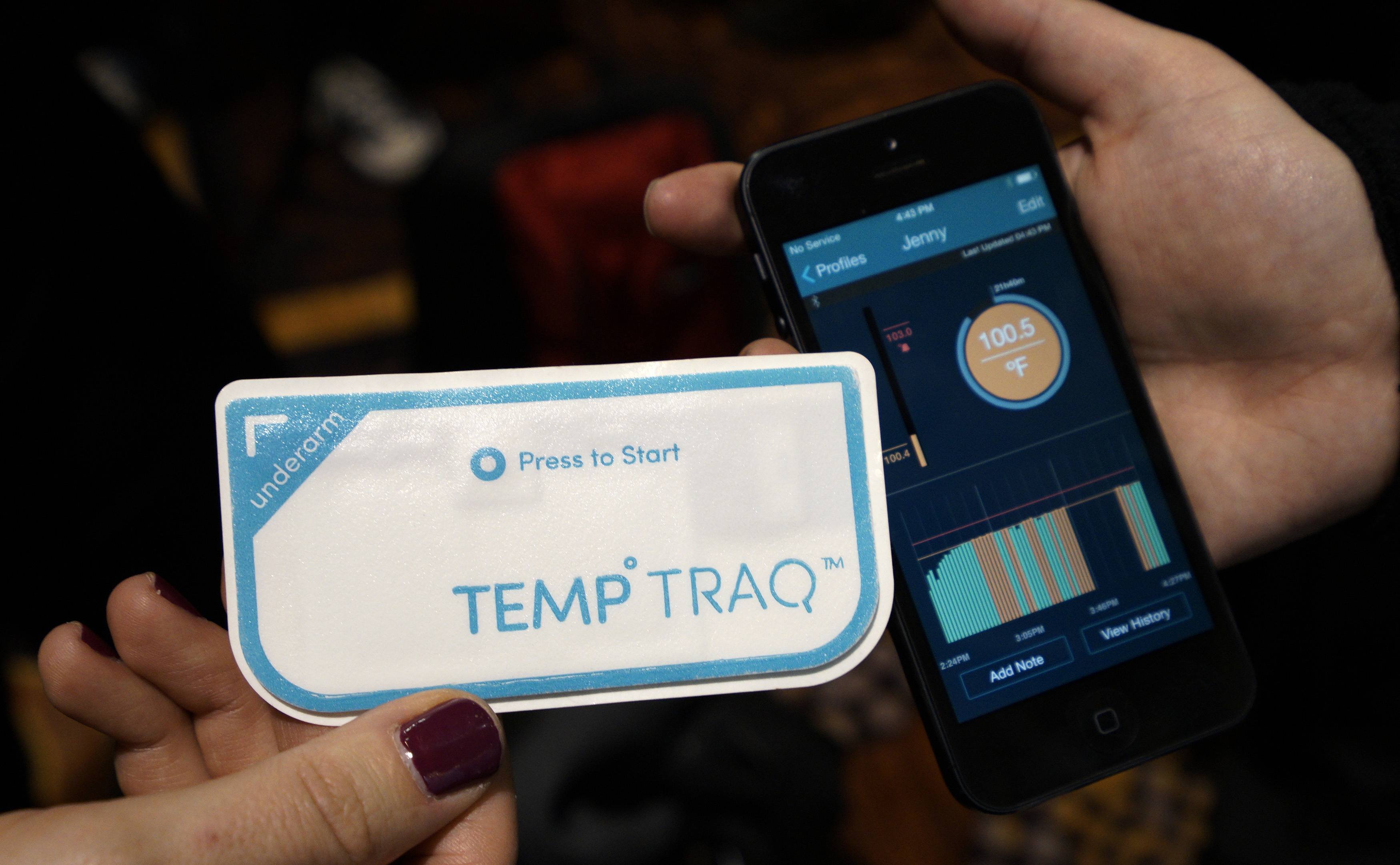 The TempTraq body temperature wearable bluetooth thermometer and its accompanying app are displayed at the International Consumer Electronics show (CES) in Las Vegas on Jan. 4, 2014. (Rick Wilking—Reuters)