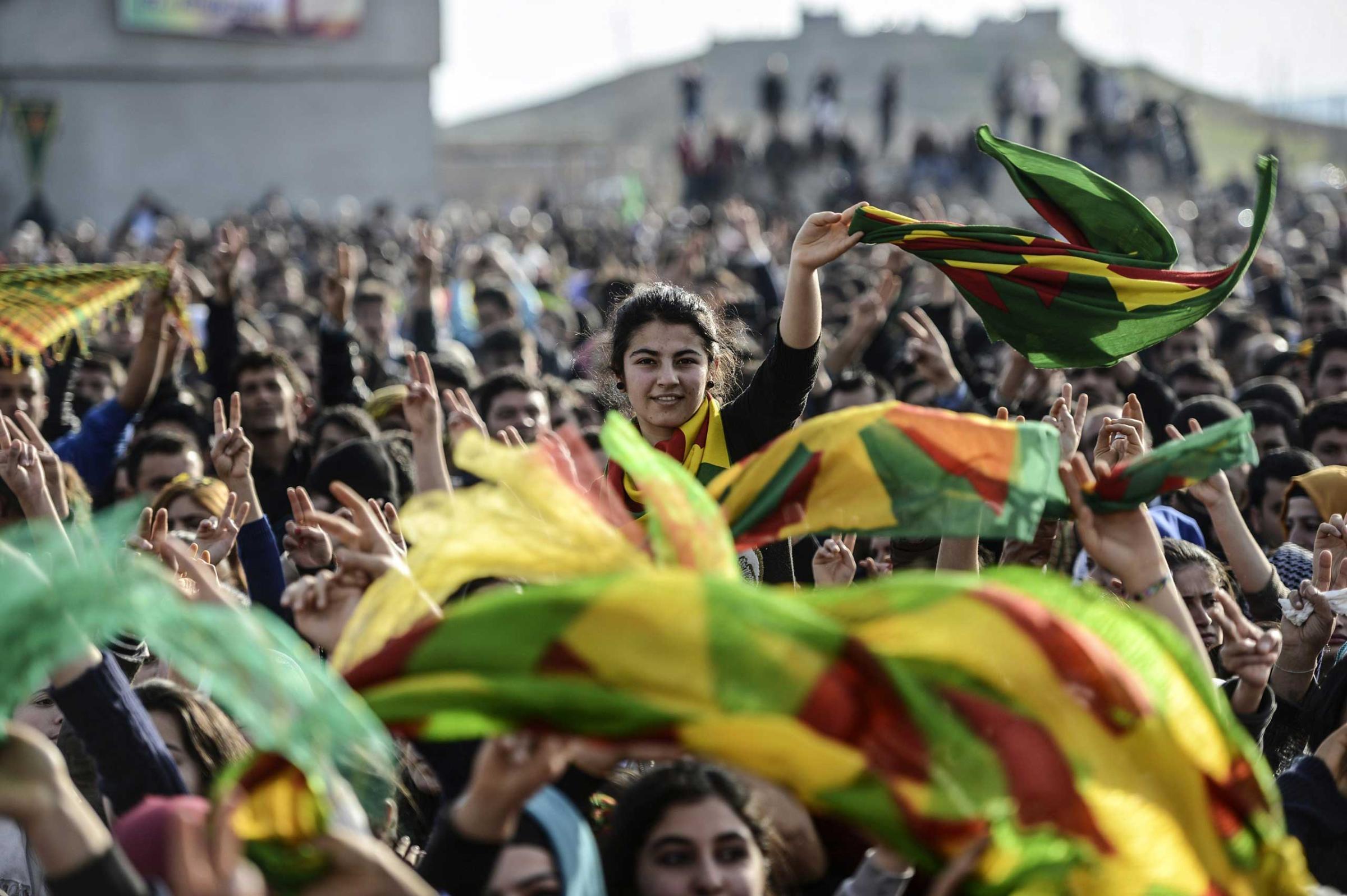 Kurdish people attend a celebration rally near the Turkish-Syrian border in Suruc, Jan. 27, 2015.