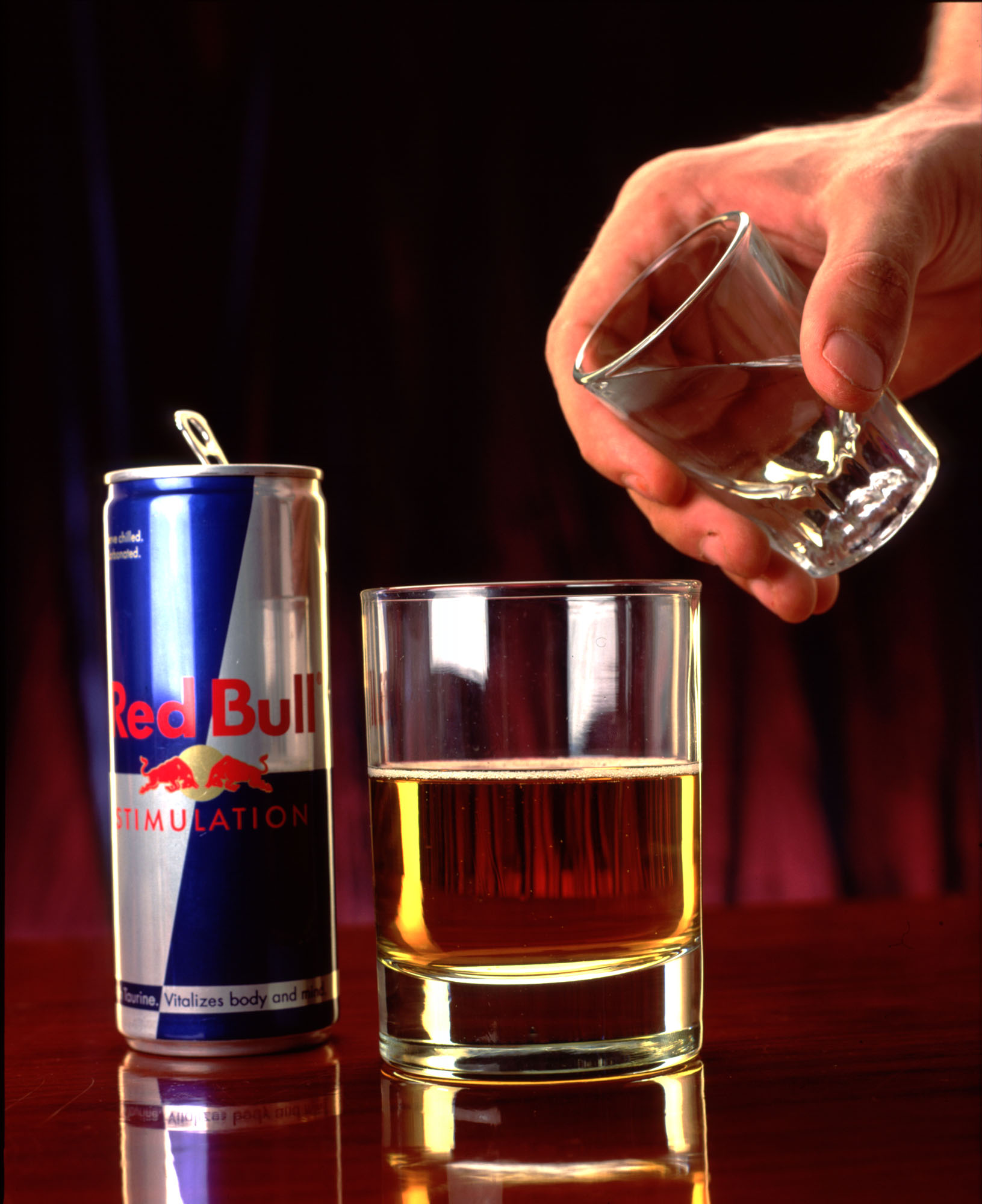 370699 02: A shot of vodka is poured into a "Red Bull" energy drink in this 1999 photo taken in Los Angeles, CA. The mixed drink keep club goers buzzed but wide awake while partying. They''re calling this beverage "ecstasy in a can." (Photo by Evan Kafka/Liaison)