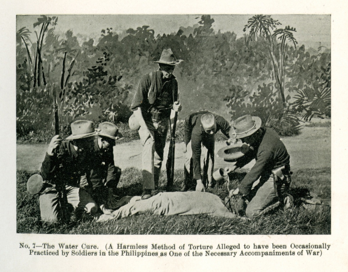 A group of American soldiers applying the 'water cure' upon a Filipino insurgent during the Philippine-American War, circa 1900. From a book published in 1902. (Interim Archives / Getty Images)