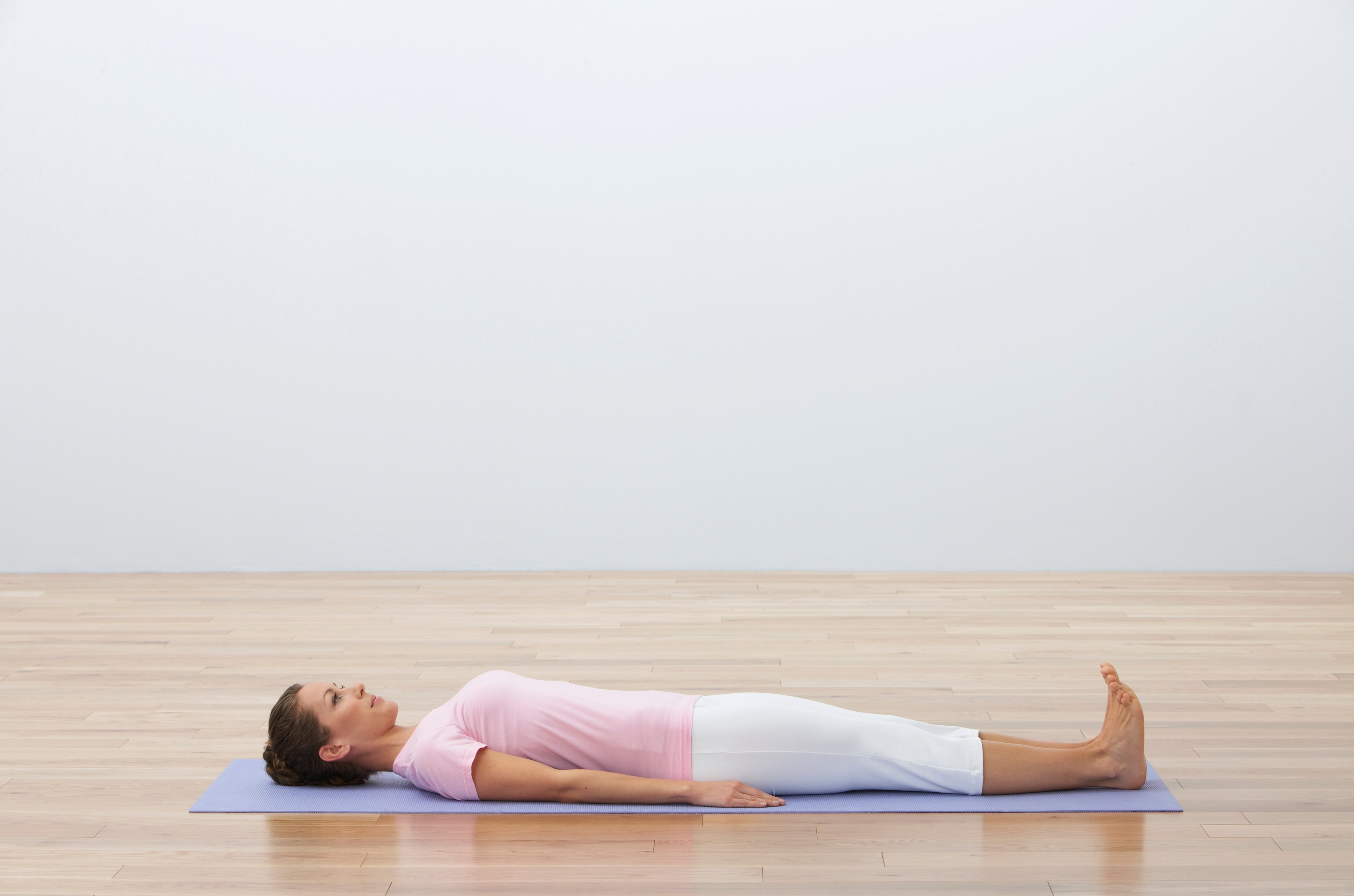 woman-lying-down-yoga-mat