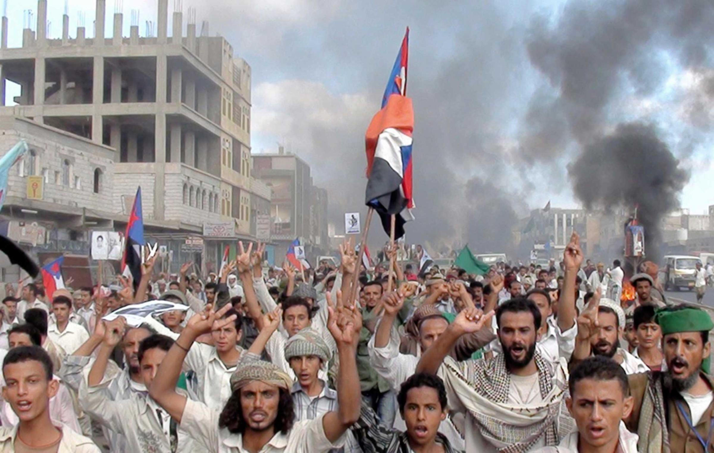 Protesters march during an anti-government demonstration in Radfan, a district in the southern Yemeni province of Lahej