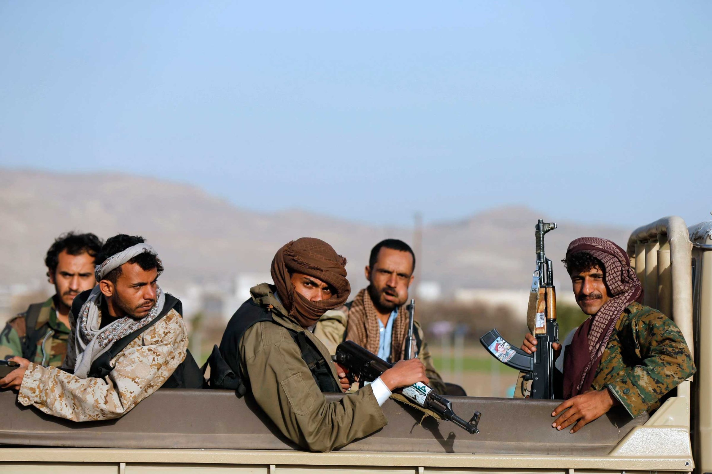Houthi fighters ride a truck near the presidential palace in Sanaa, Jan. 22. 2015.