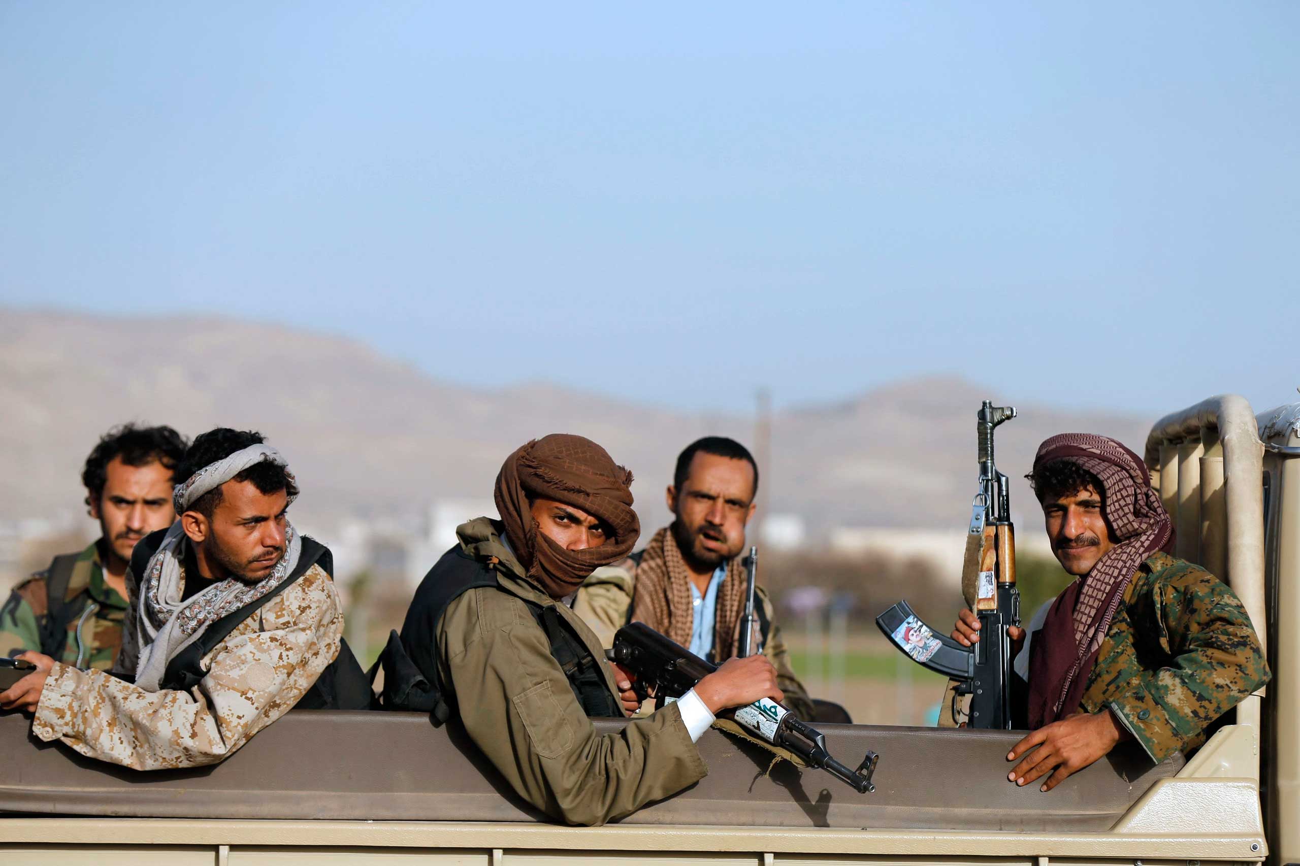 Houthi fighters ride a truck near the presidential palace in Sanaa, Jan. 22. 2015. (Khaled Abdullah—Reuters)