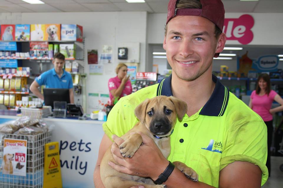 Ben Henderson and his adopted puppy Raffa at Pet's Haven Animal Shelter in Melbourne, Australia.