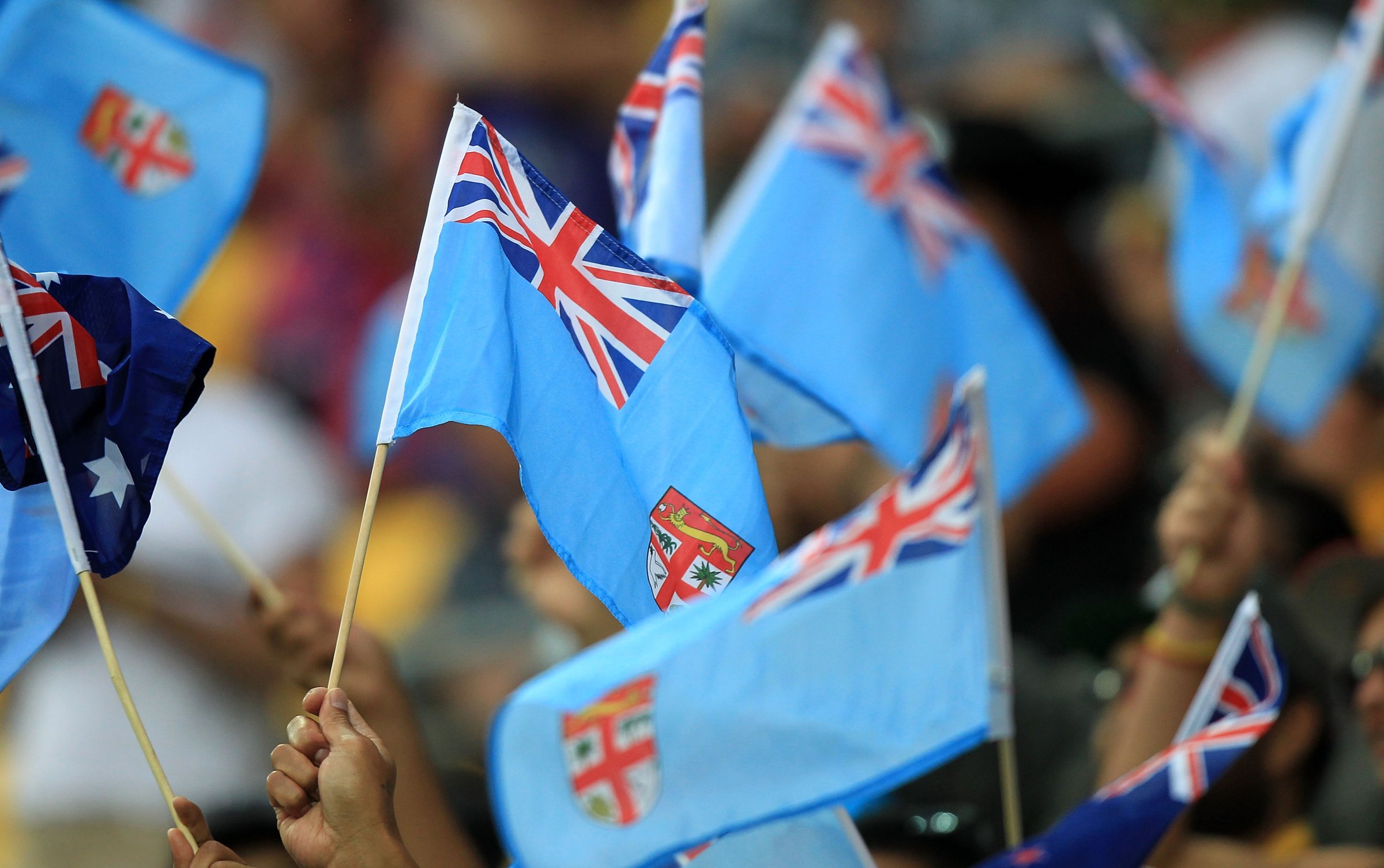 Fijian flags are waved during pool play